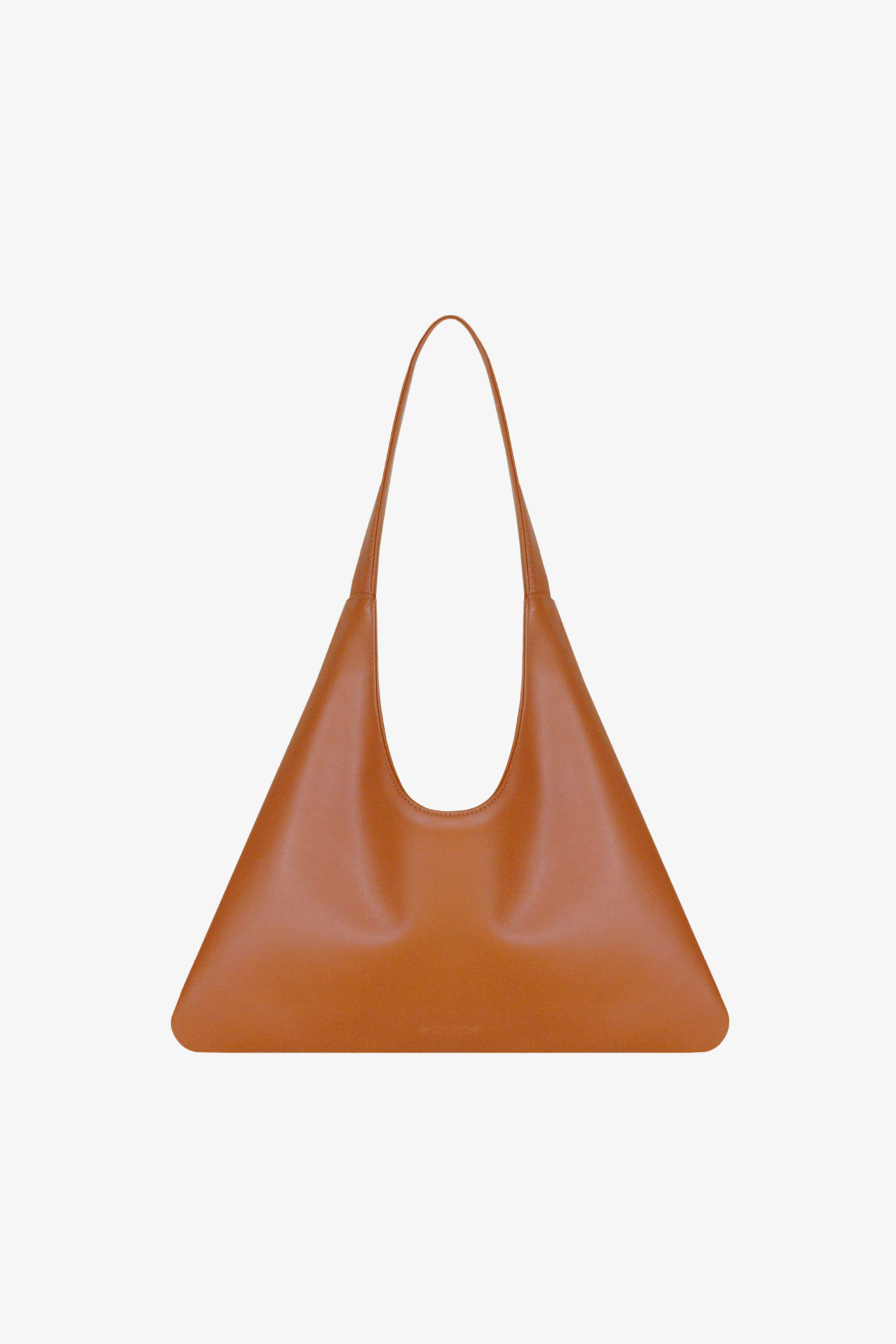 Cognac handbag made of cactus leather on a white background