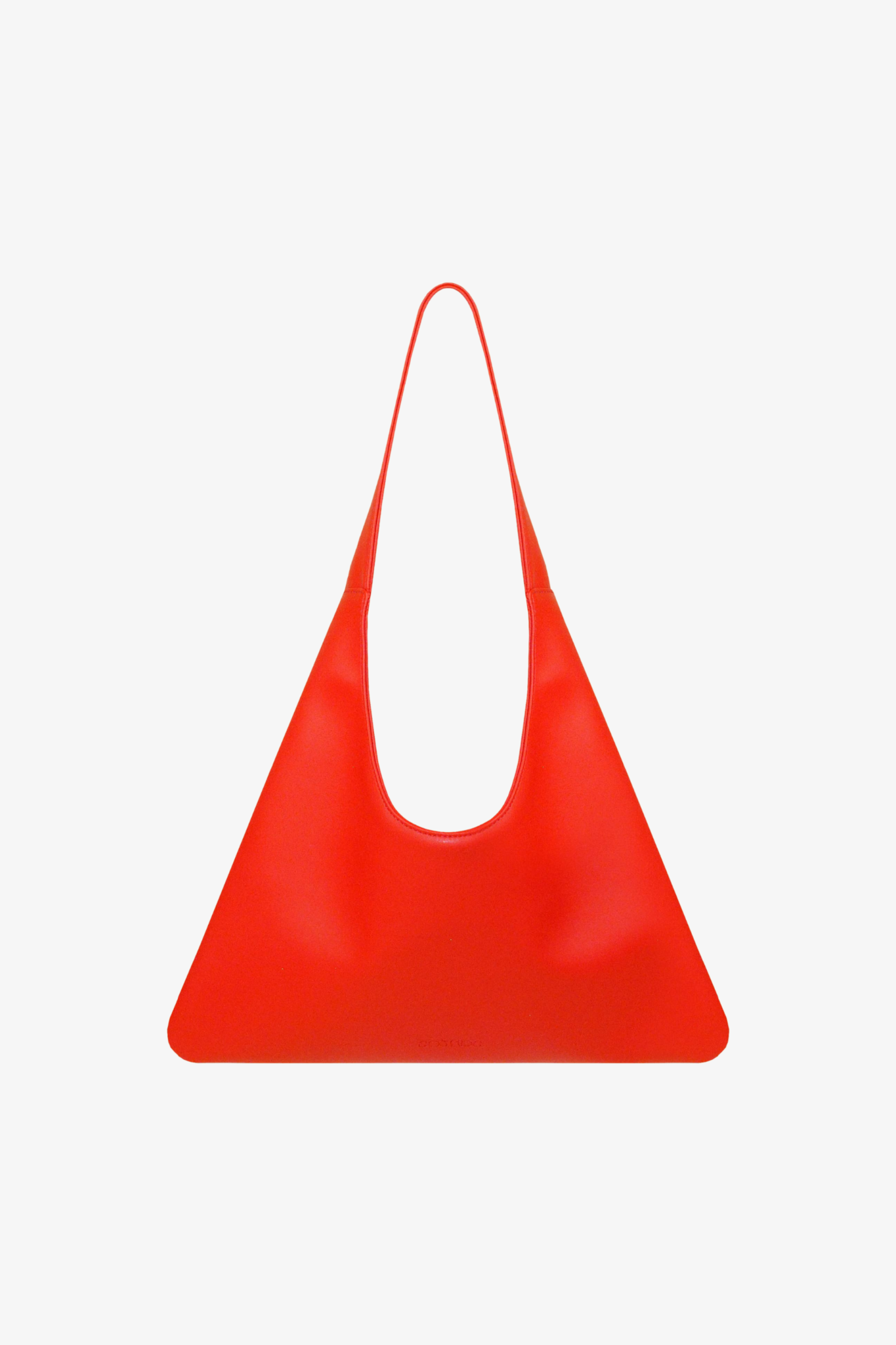 Red sustainable handbag made from cactus leather on a white background.