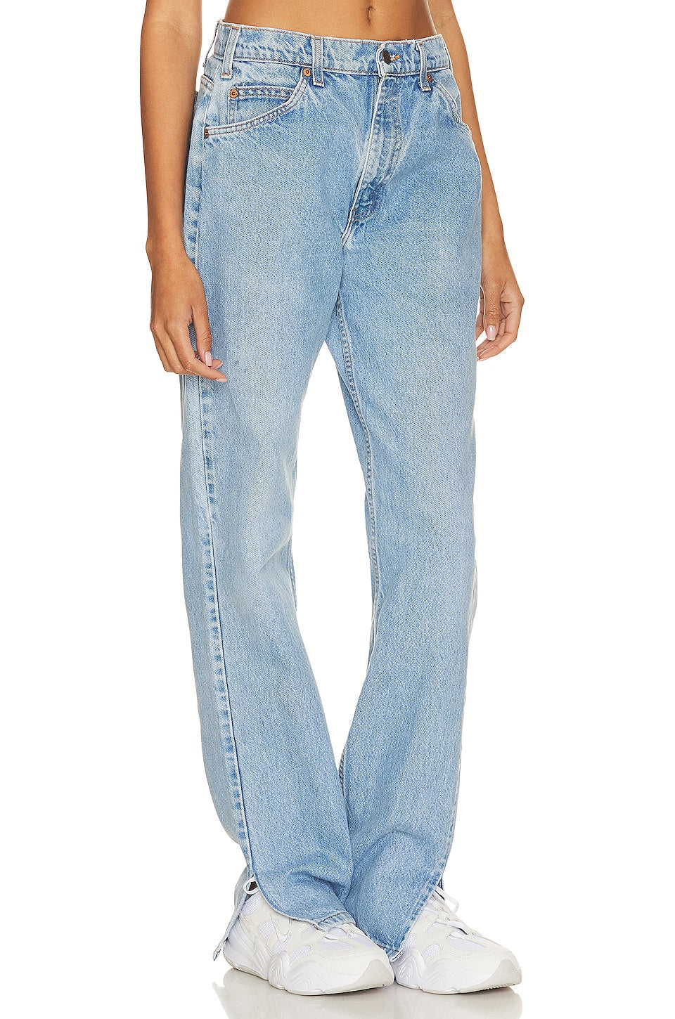 Model wearing a tilted split customs in a white background. 100% made from repurposed Levi’s.