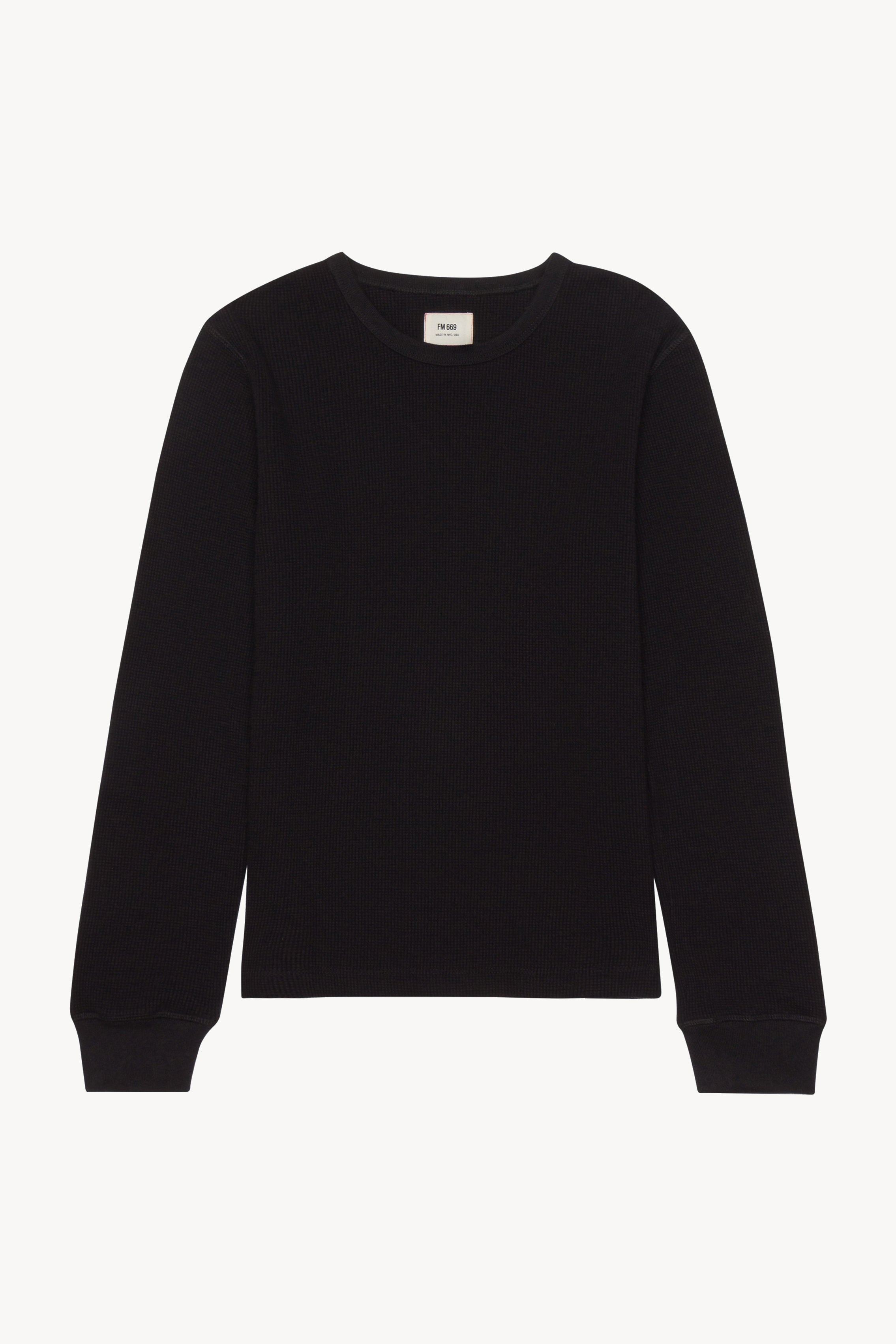 The black anthony waffle l/s in a white background. 100% made from organic grown cotton.
