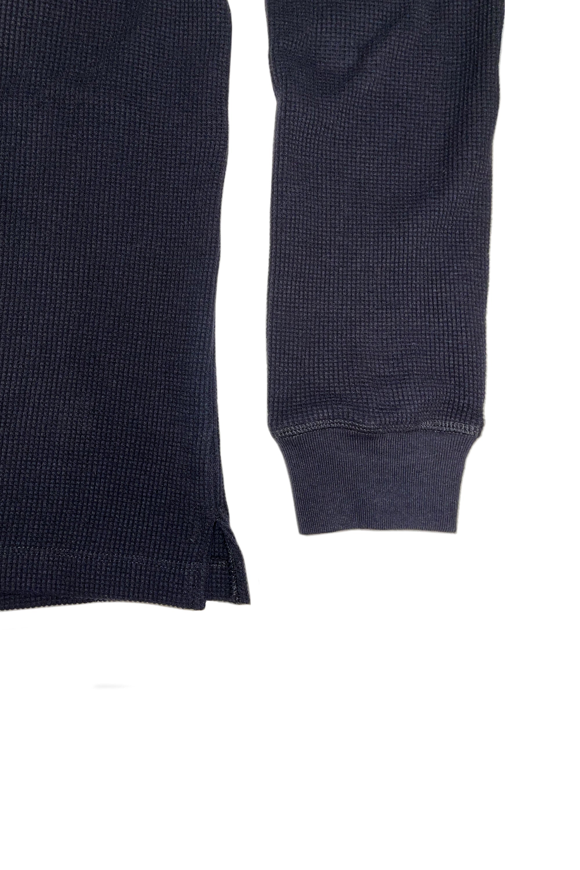 Close-up of the black anthony waffle l/s in a white background. 100% made from organic grown cotton.