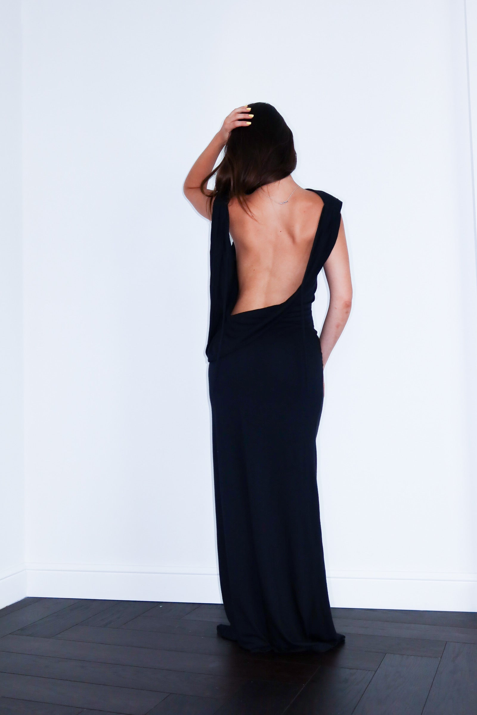 A model wearing the axis silk jersey dress in a white background. 100% made from deadstock.