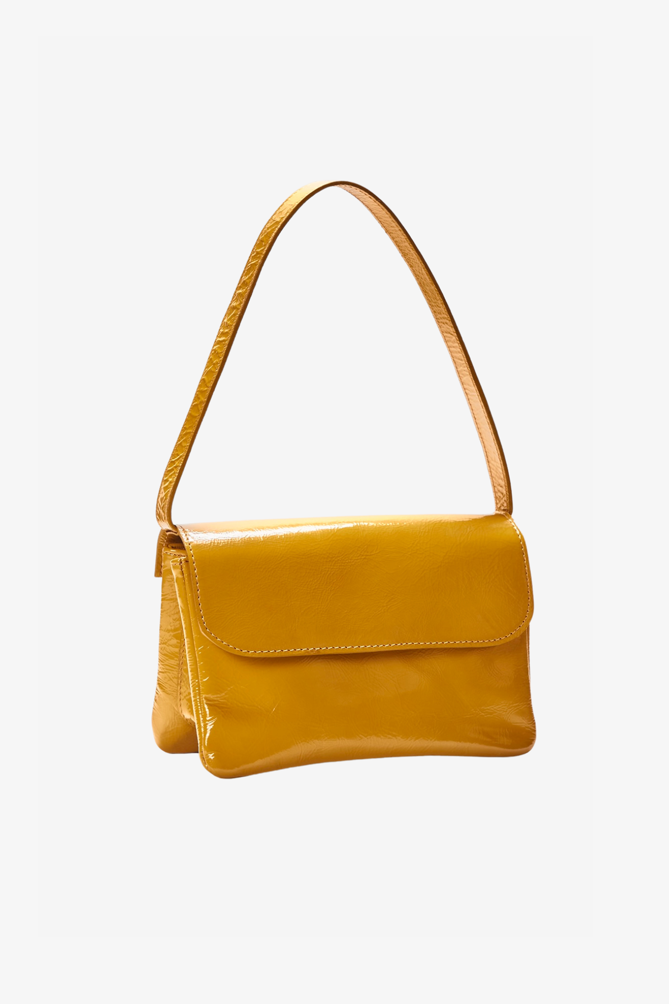 The babe mustard bag in a white background. 100% made from deadstock leather.
