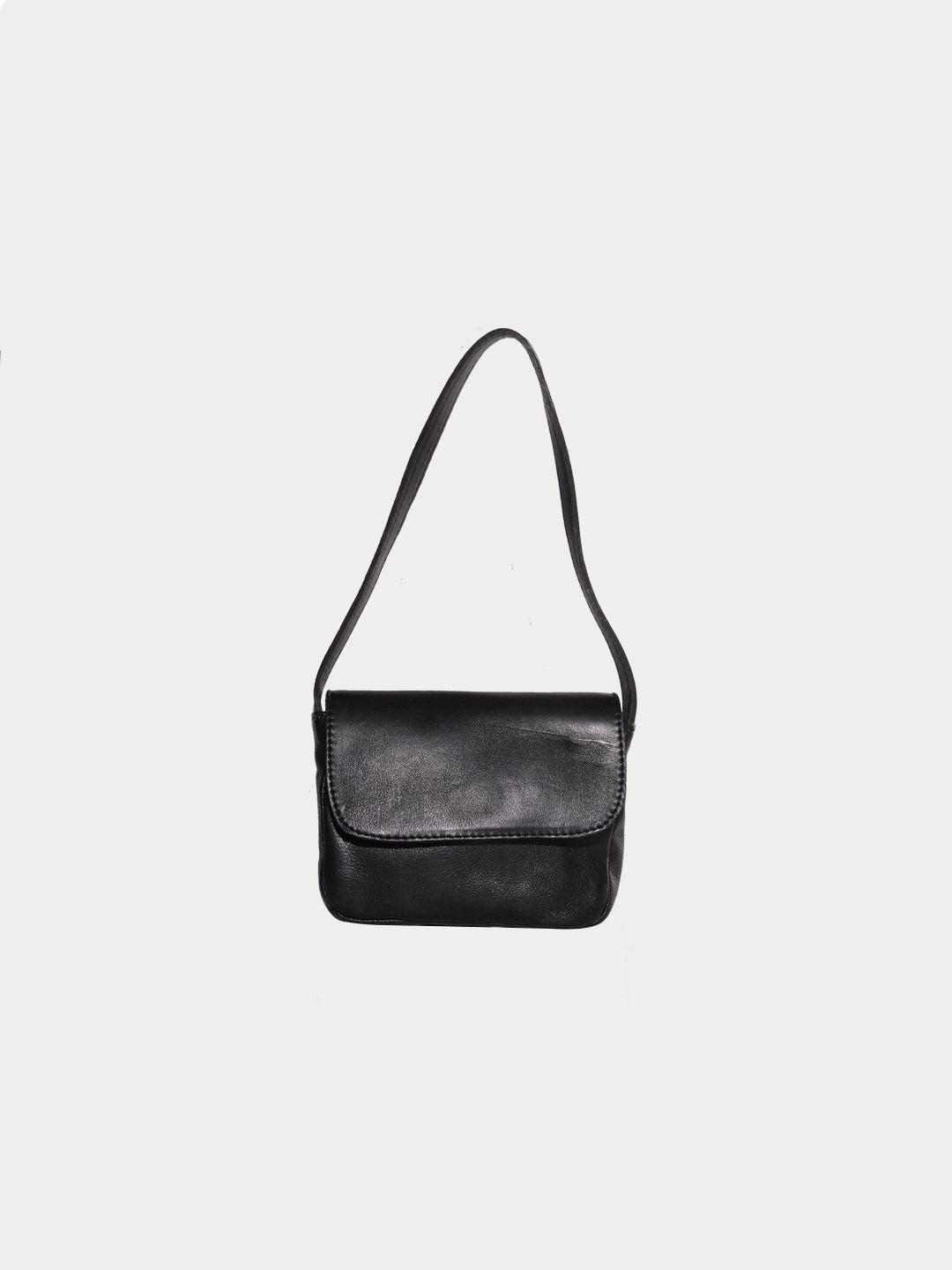 The baby black matte bag in a white background. 100% made from deadstock leather.