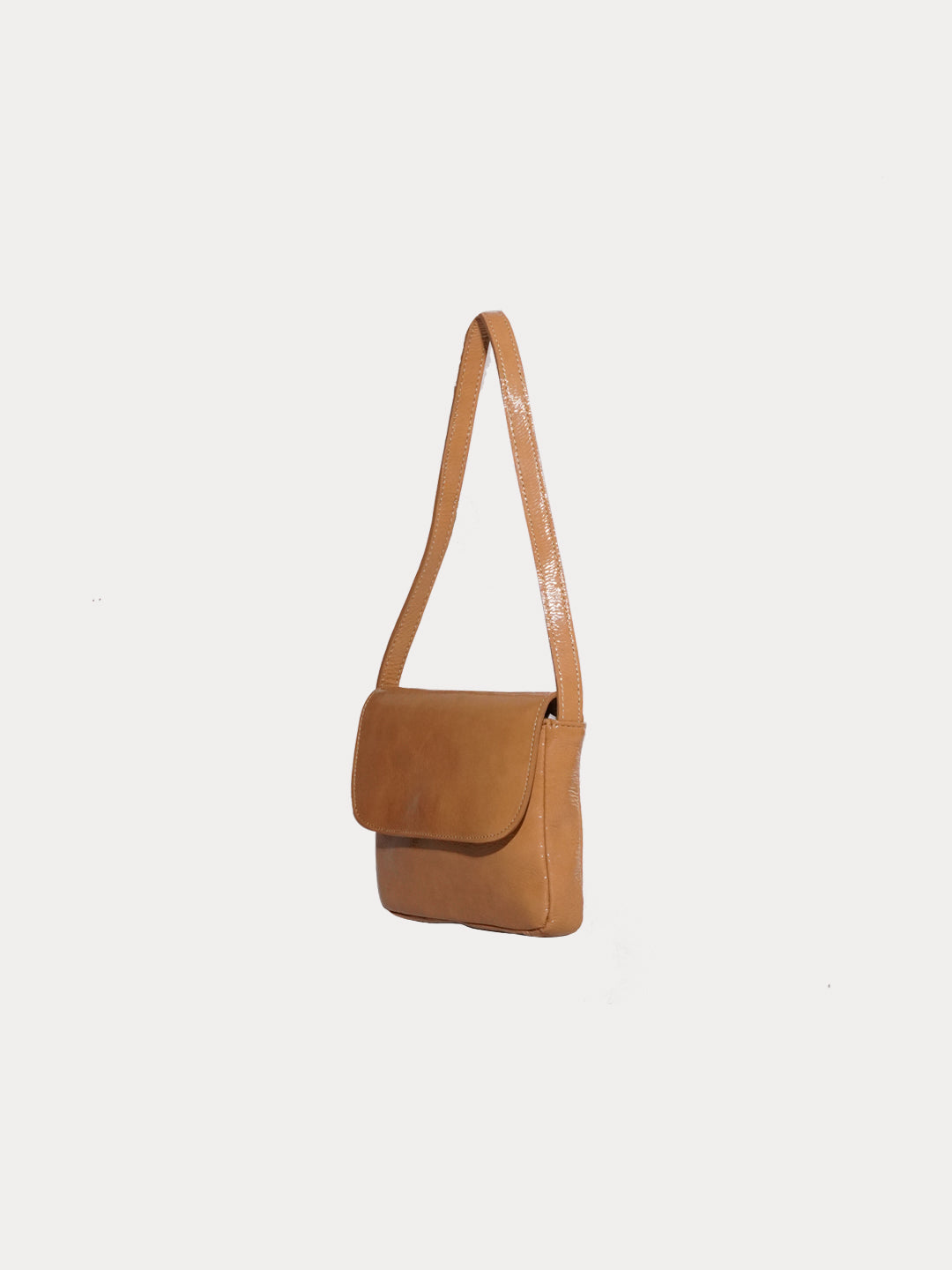 The baby camel bag in a white background. 100% made from deadstock leather.