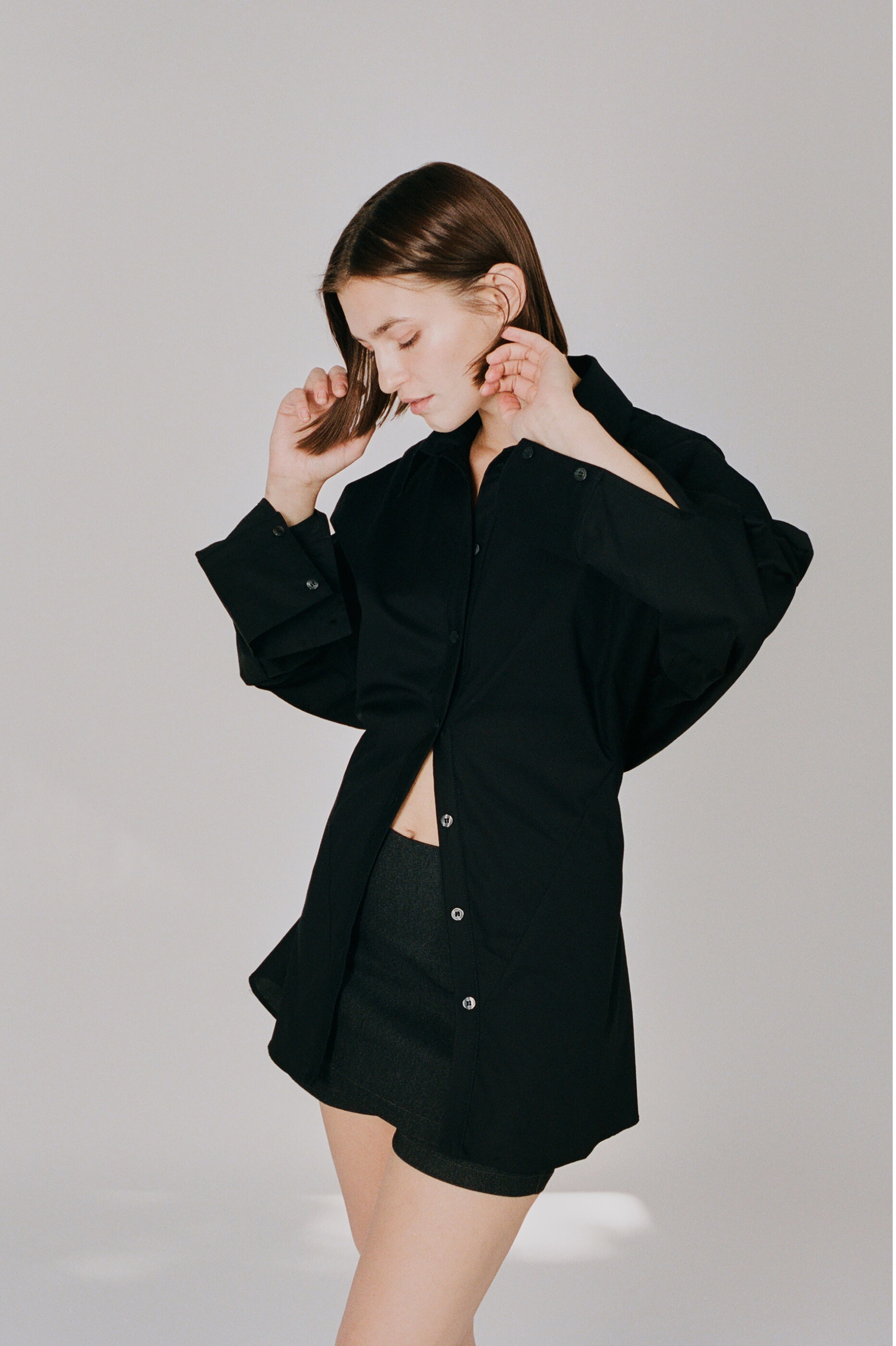 girl wearing faro cinched button up shirt in black