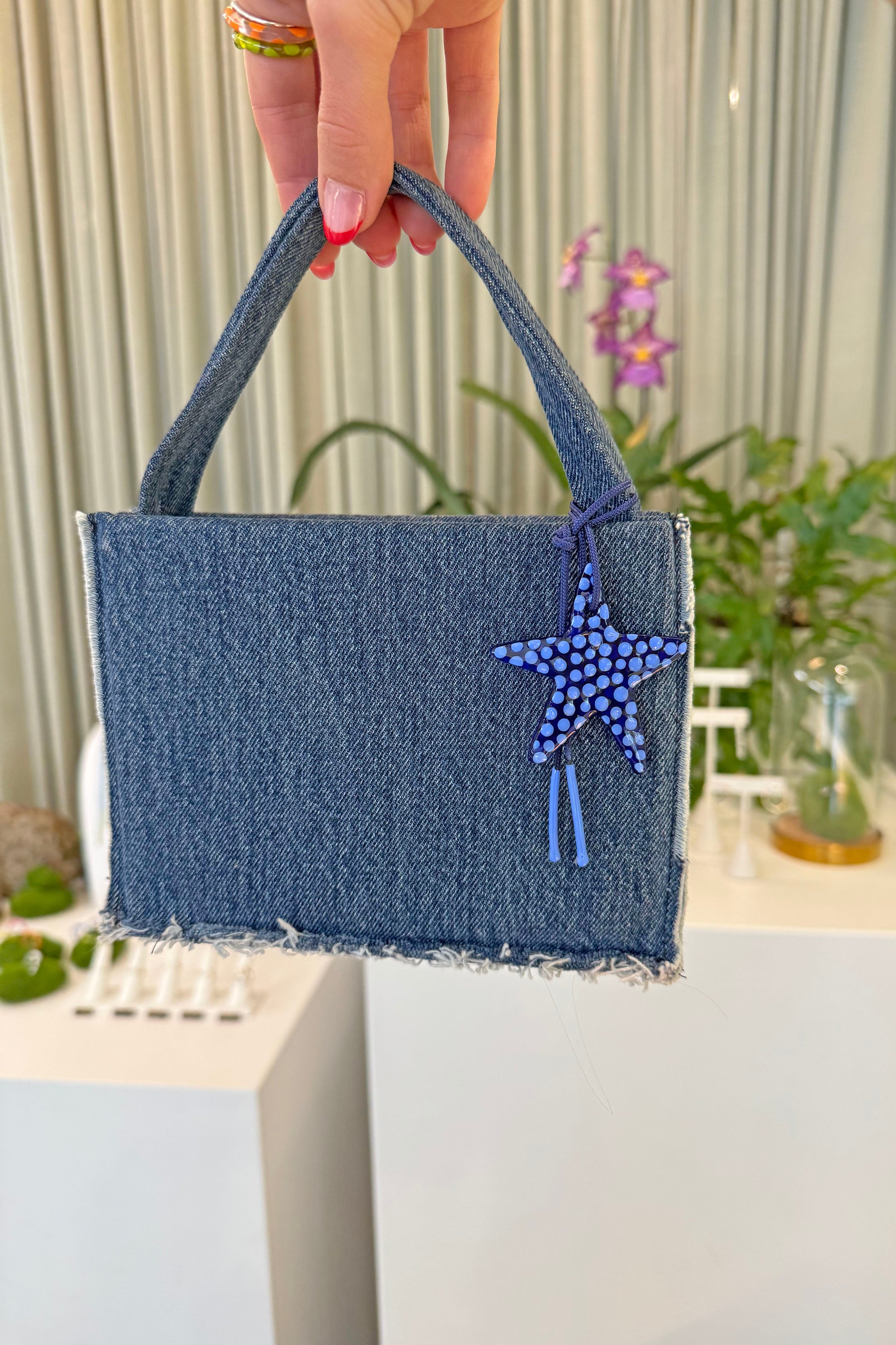 The blueberry charm in an aesthetically background. Charm are 3D printed and hand finished. Made in New York. CLOSE_UP