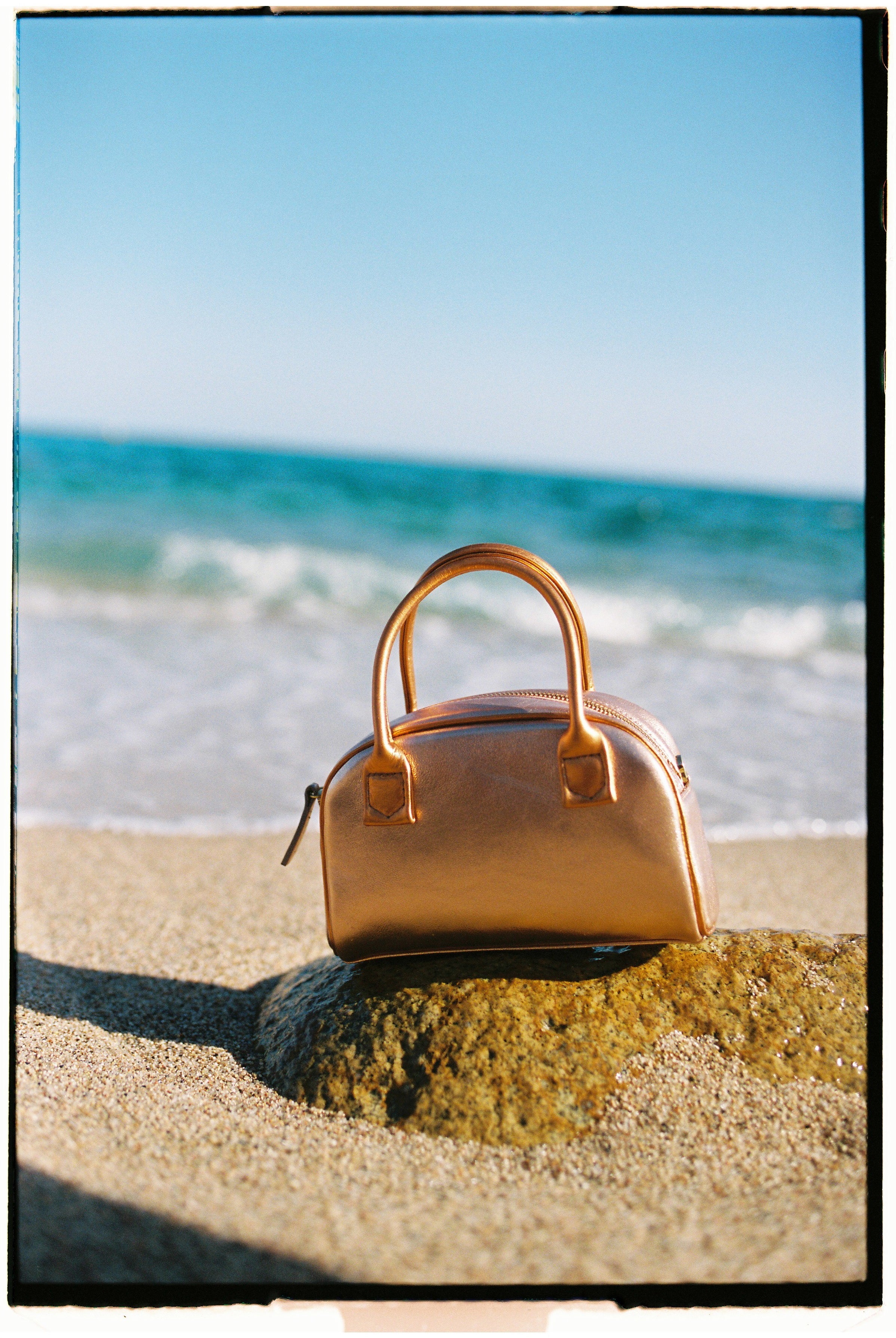 The bowling tropico bag in an aesthetically background. 100% made from deadstock leather.
