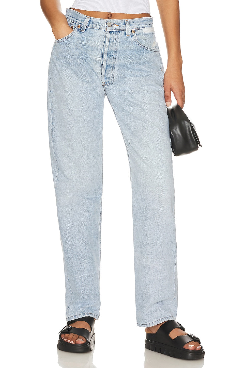 Model wearing the Brigette baggy customs in a white background. 100% made from repurposed Levi’s.