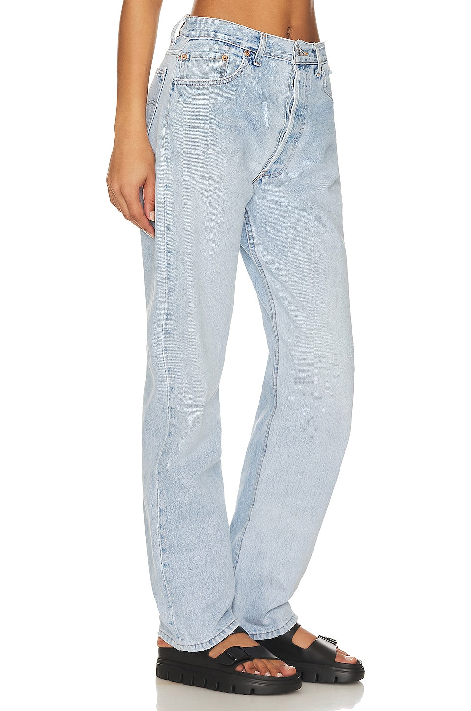 Model wearing the Brigette baggy customs in a white background. 100% made from repurposed Levi’s.