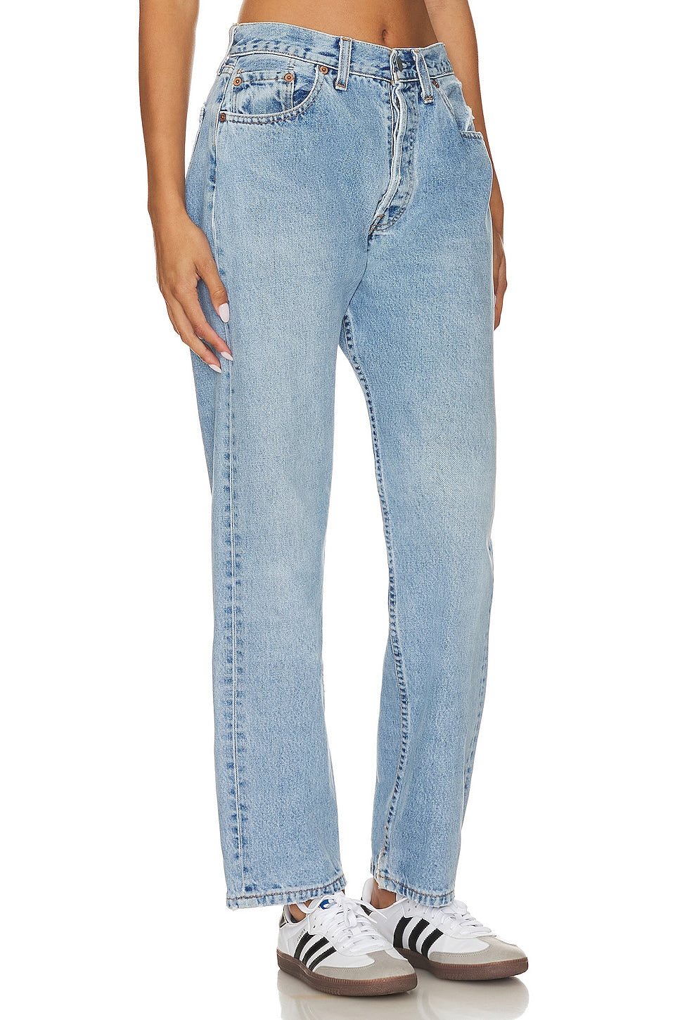 Model wearing the Brigette baggy customs in a white background. 100% made from repurposed Levi’s.