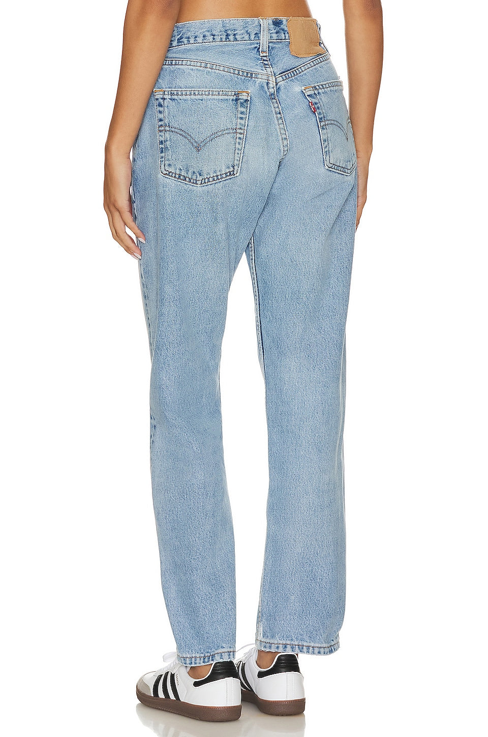 Model wearing the Brigette baggy customs in a white background. 100% made from repurposed Levi’s.