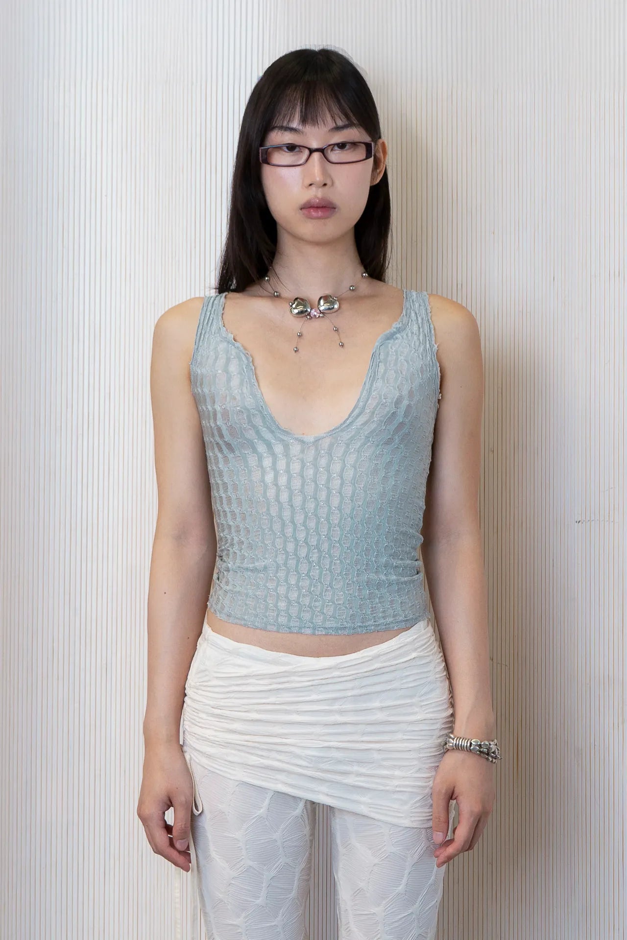 The dew tank in a white background. Used dead stock fabric. Poly-spandex blend.