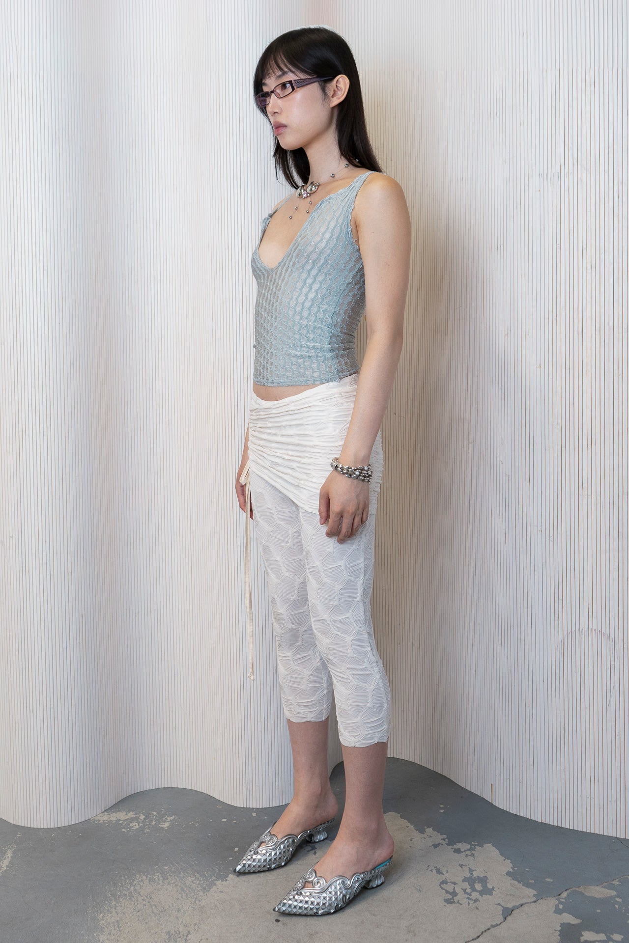 The dew tank in a white background. Used dead stock fabric. Poly-spandex blend.