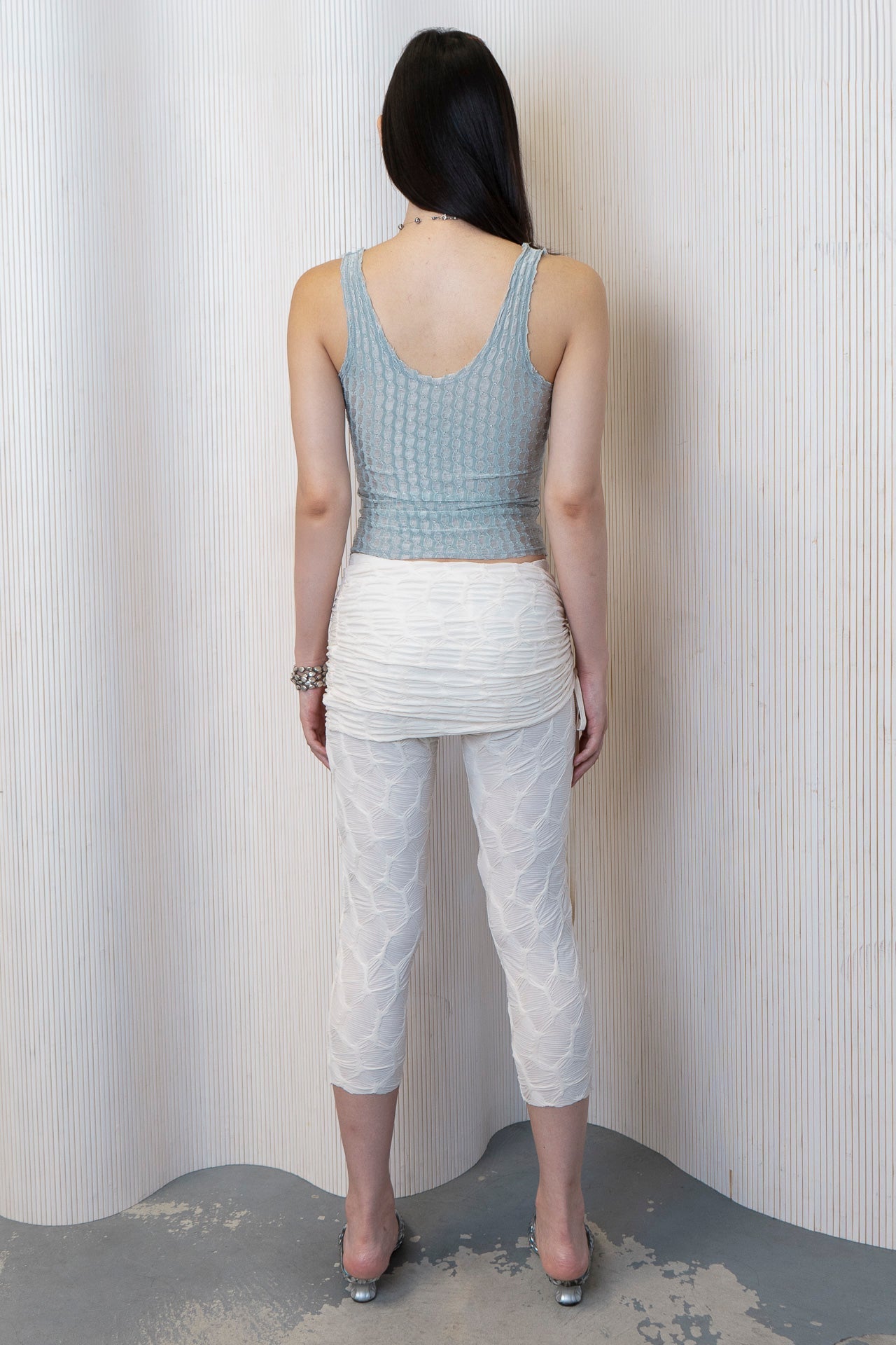 The dew tank in a white background. Used dead stock fabric. Poly-spandex blend.