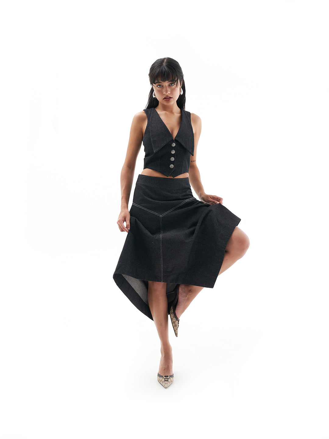 A model wearing the Genevieve skirt in a white background. 100% made from sustainable materials.