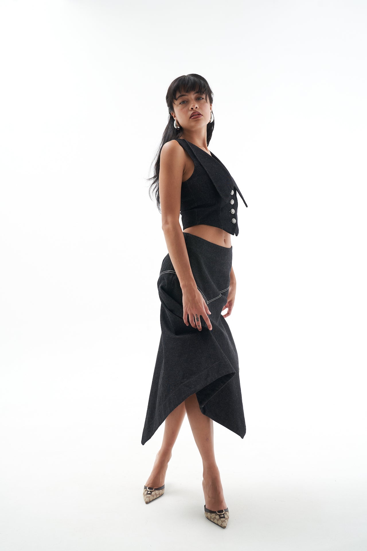 A model wearing the Genevieve skirt in a white background. 100% made from sustainable materials.