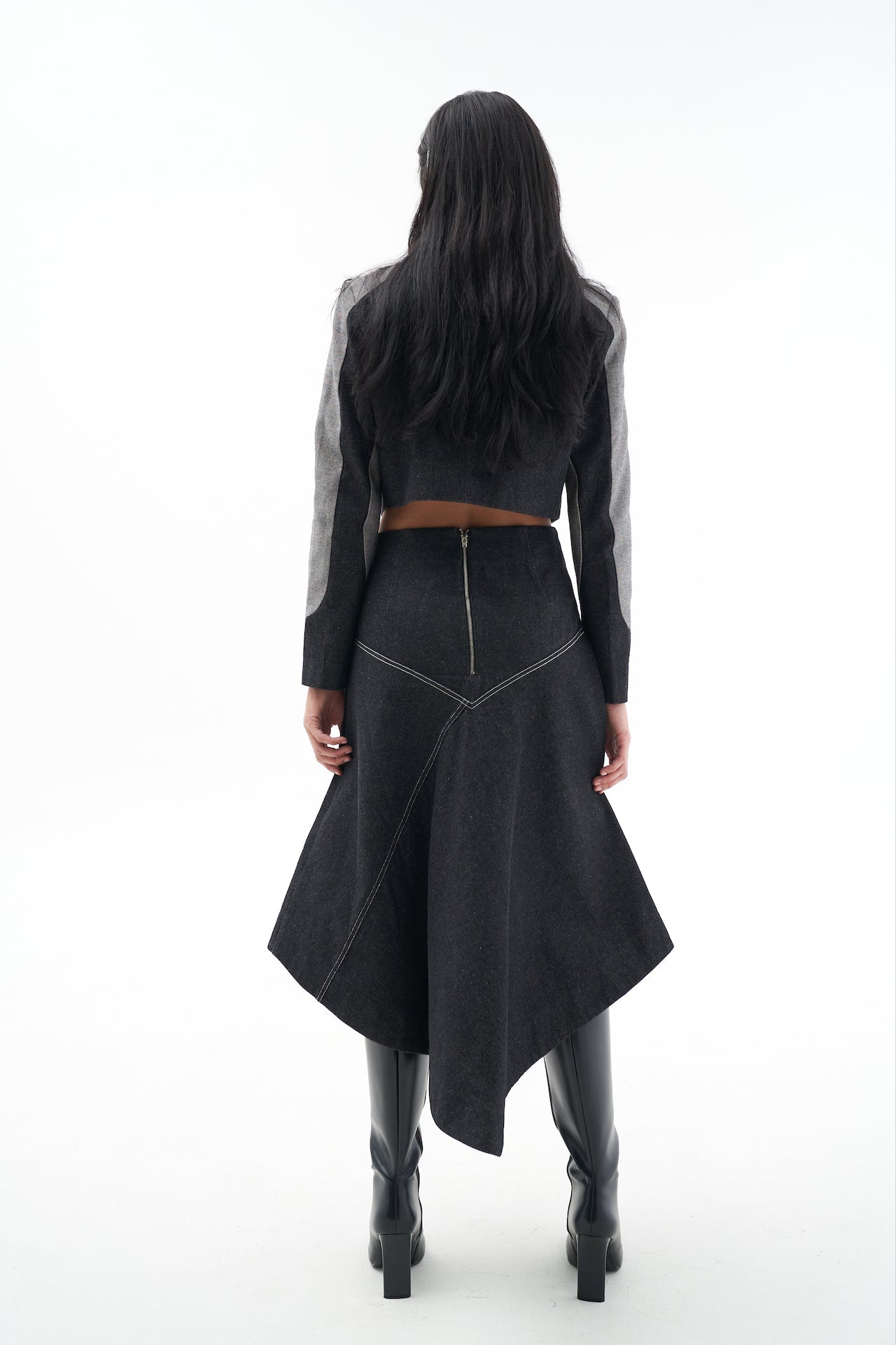 A model wearing the Genevieve skirt in a white background. 100% made from sustainable materials.
