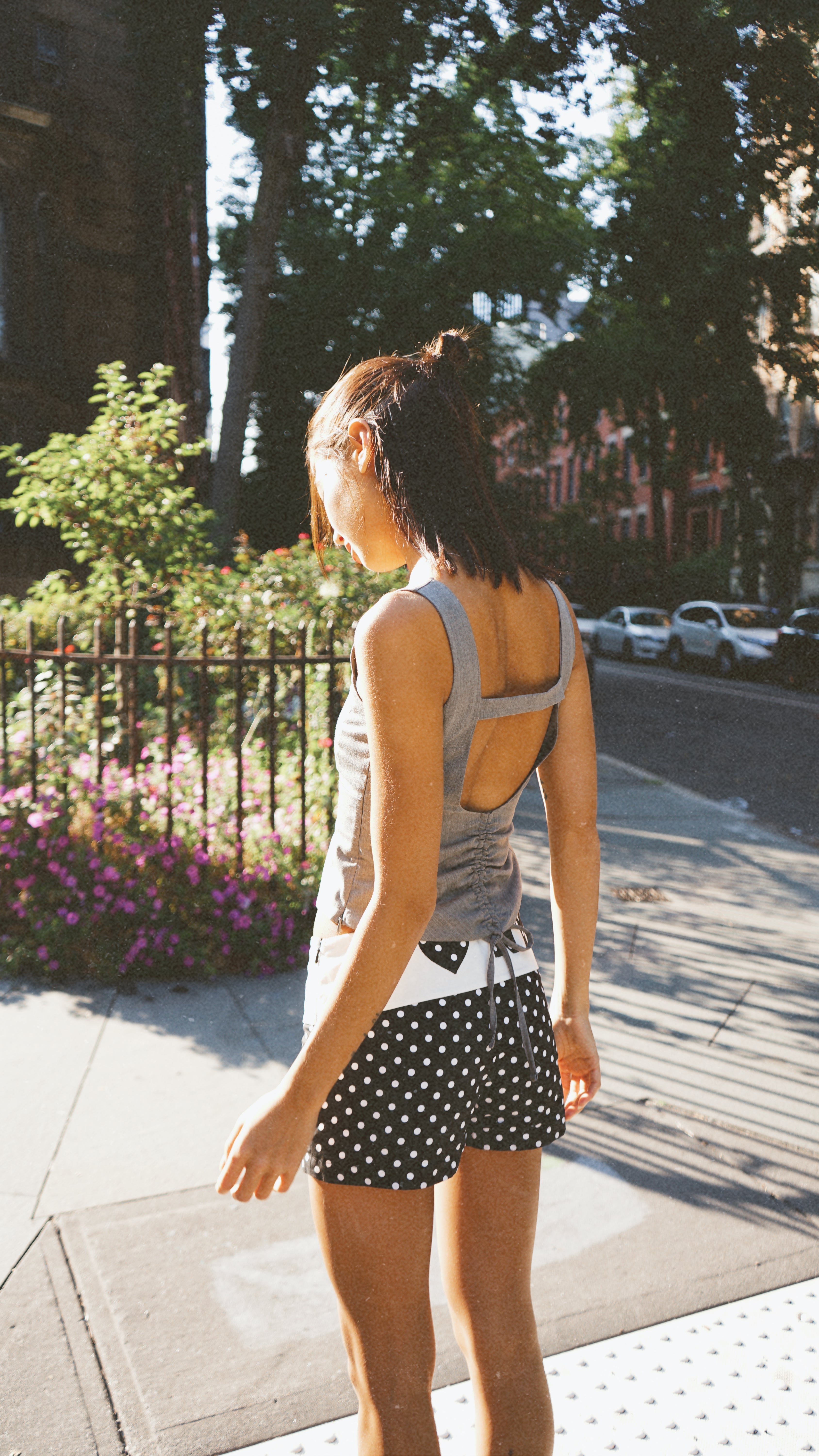 A model wearing the Georgie fold over short in an aesthetically background. 100% made from deadstock sustainable cotton.