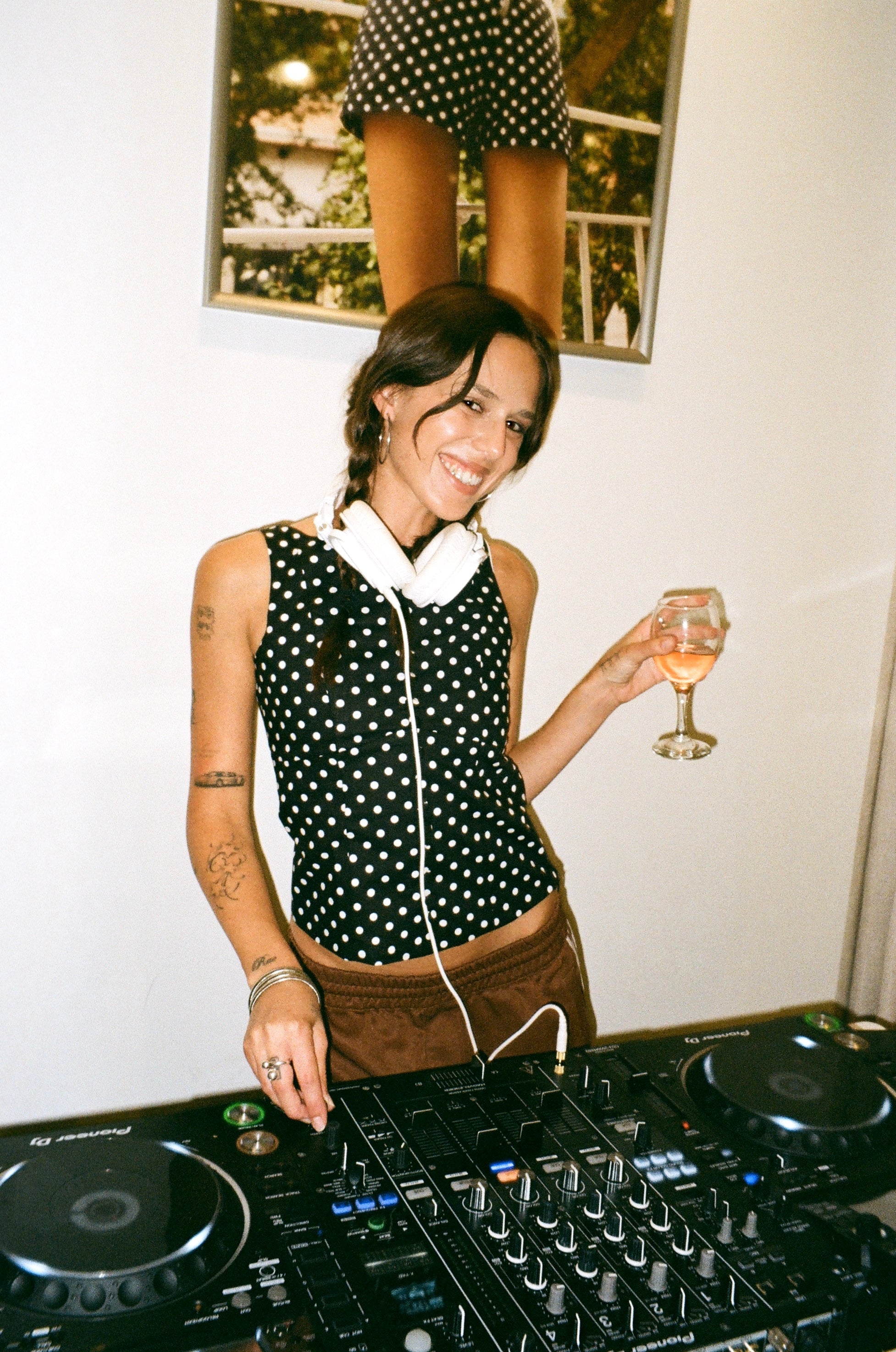 A model wearing the black Georgie top in an aesthetically background. 100% made from deadstock sustainable cotton.