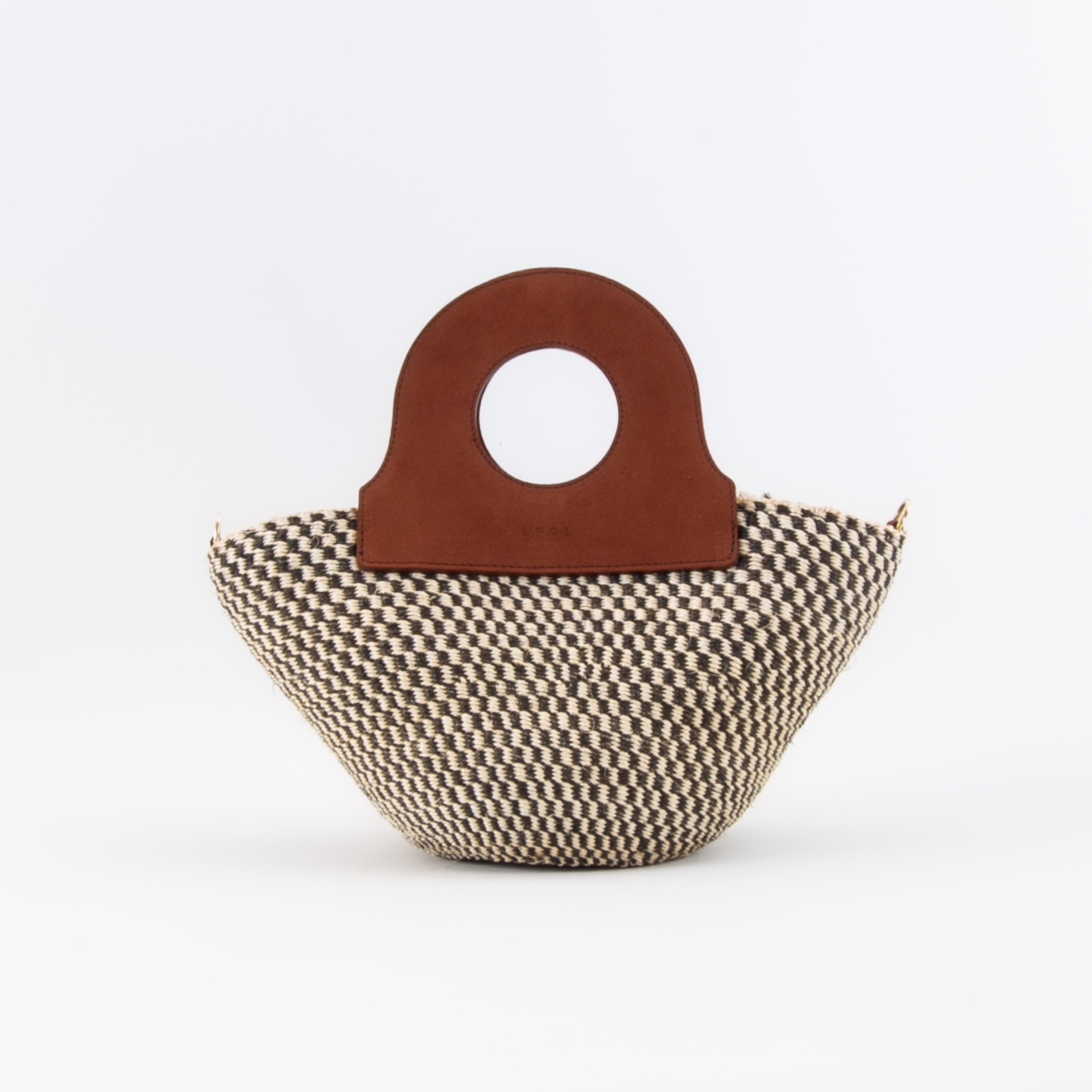 The handheld basket bag in a white background. Handwoven sisal basket made in Kenya. Finished in England using chrome-free leather.