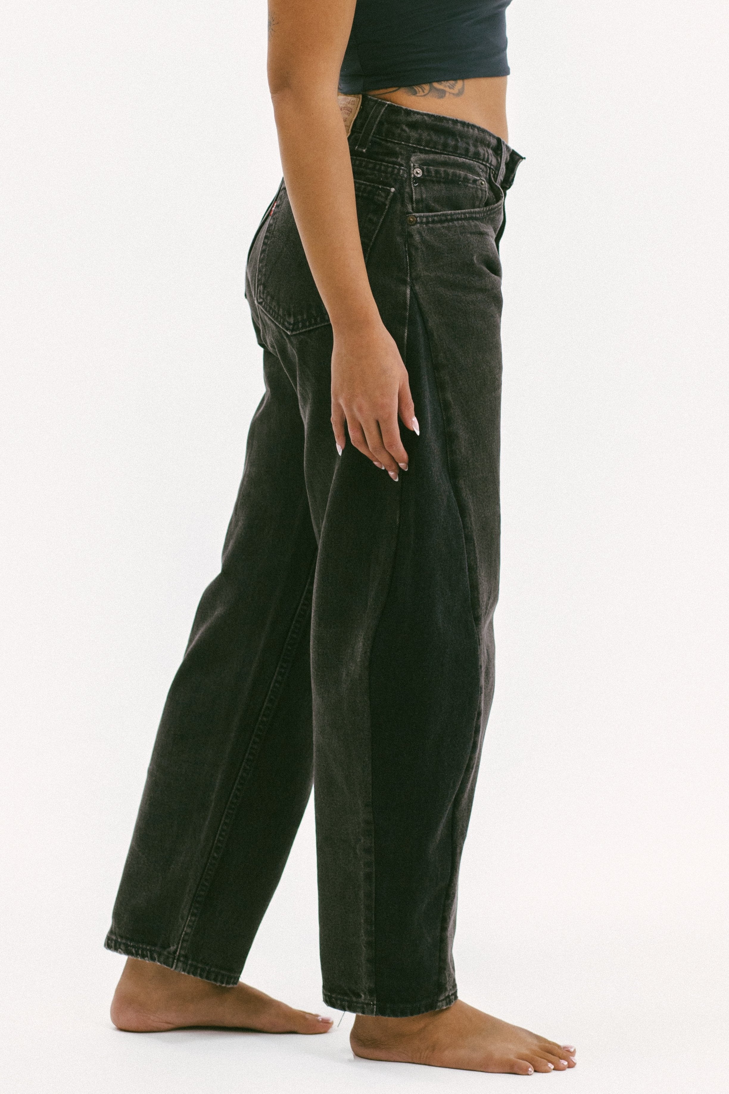 The horseshoe crop in a white background. 100% made from repurposed Levi’s.