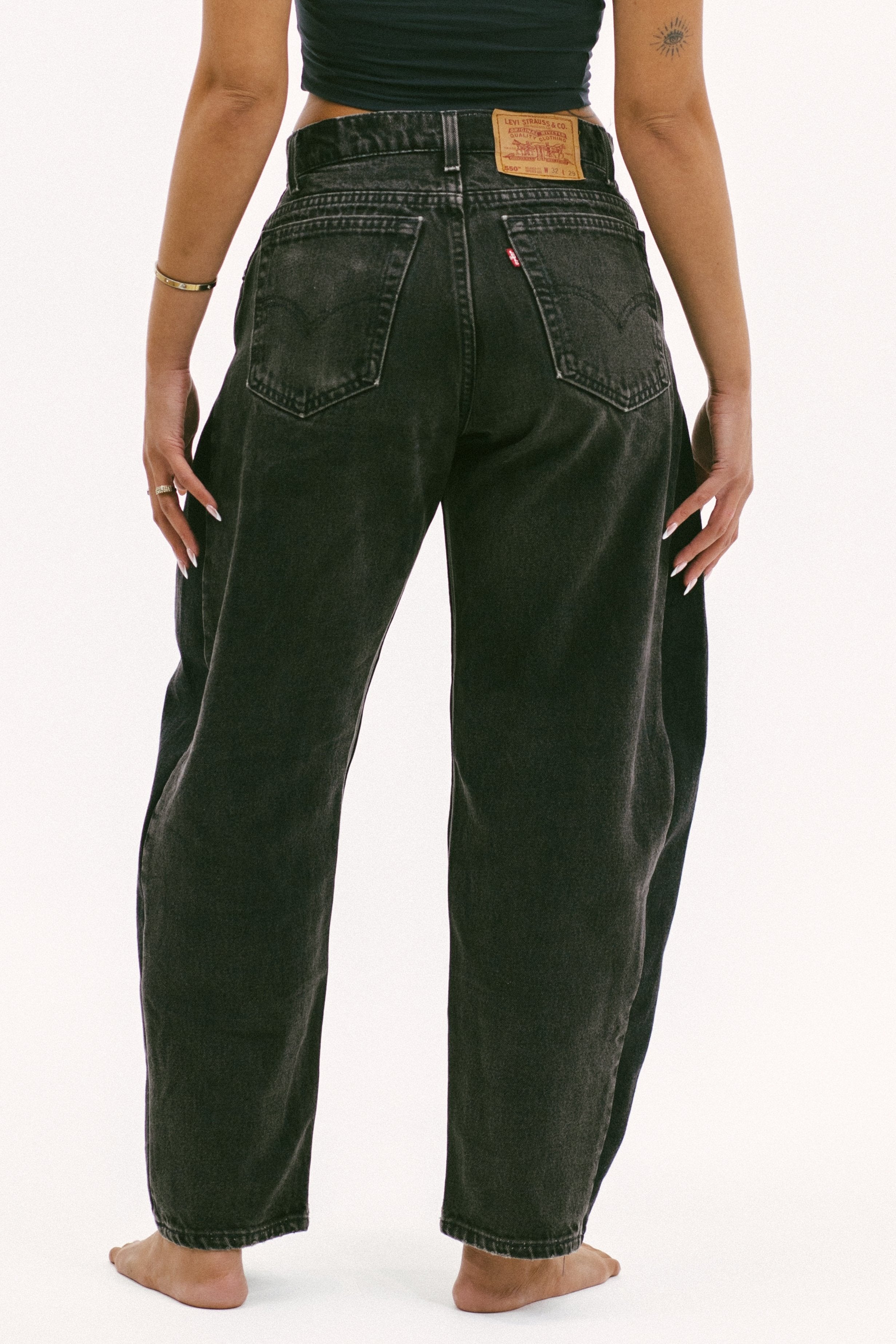 The horseshoe crop in a white background. 100% made from repurposed Levi’s.