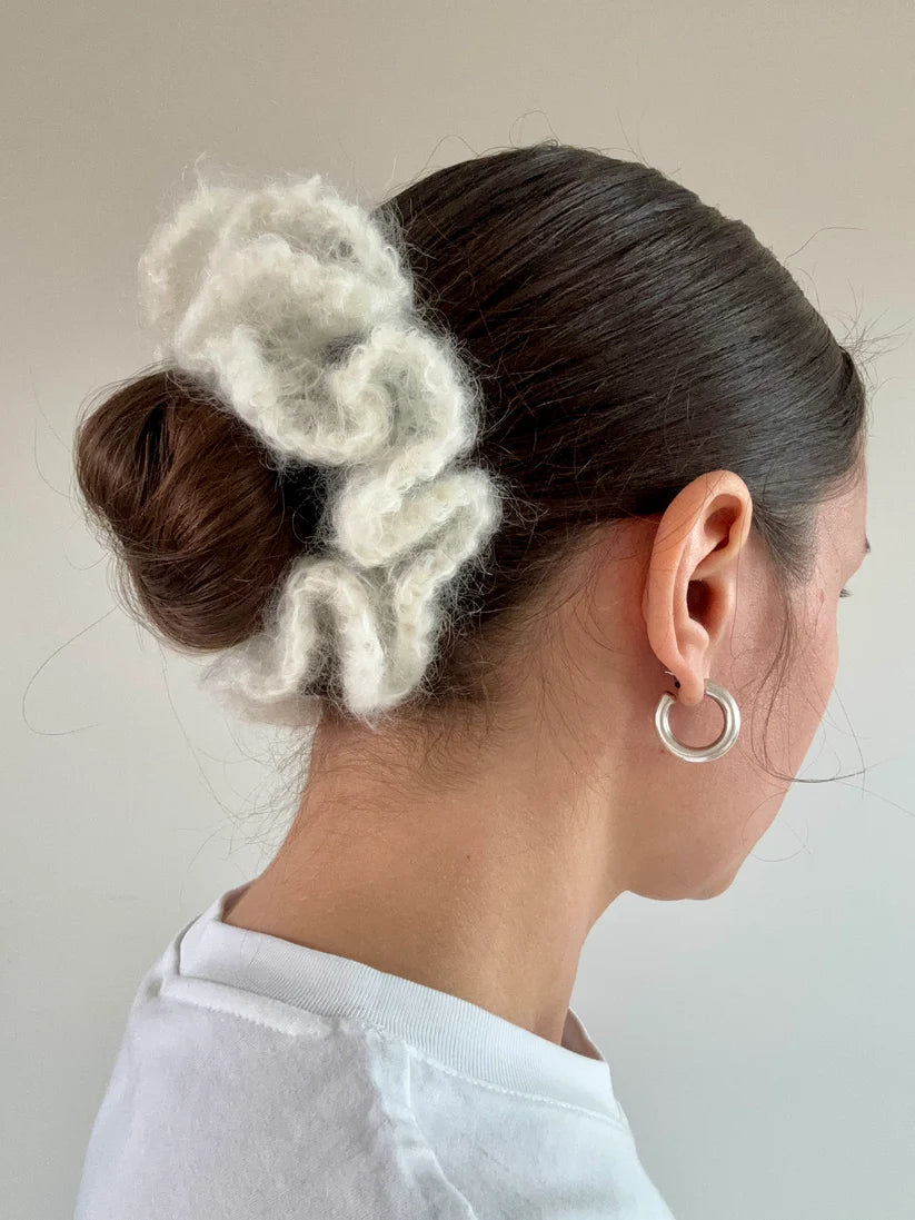 A model wearing the irine scrunchie in a white background. Handmade in