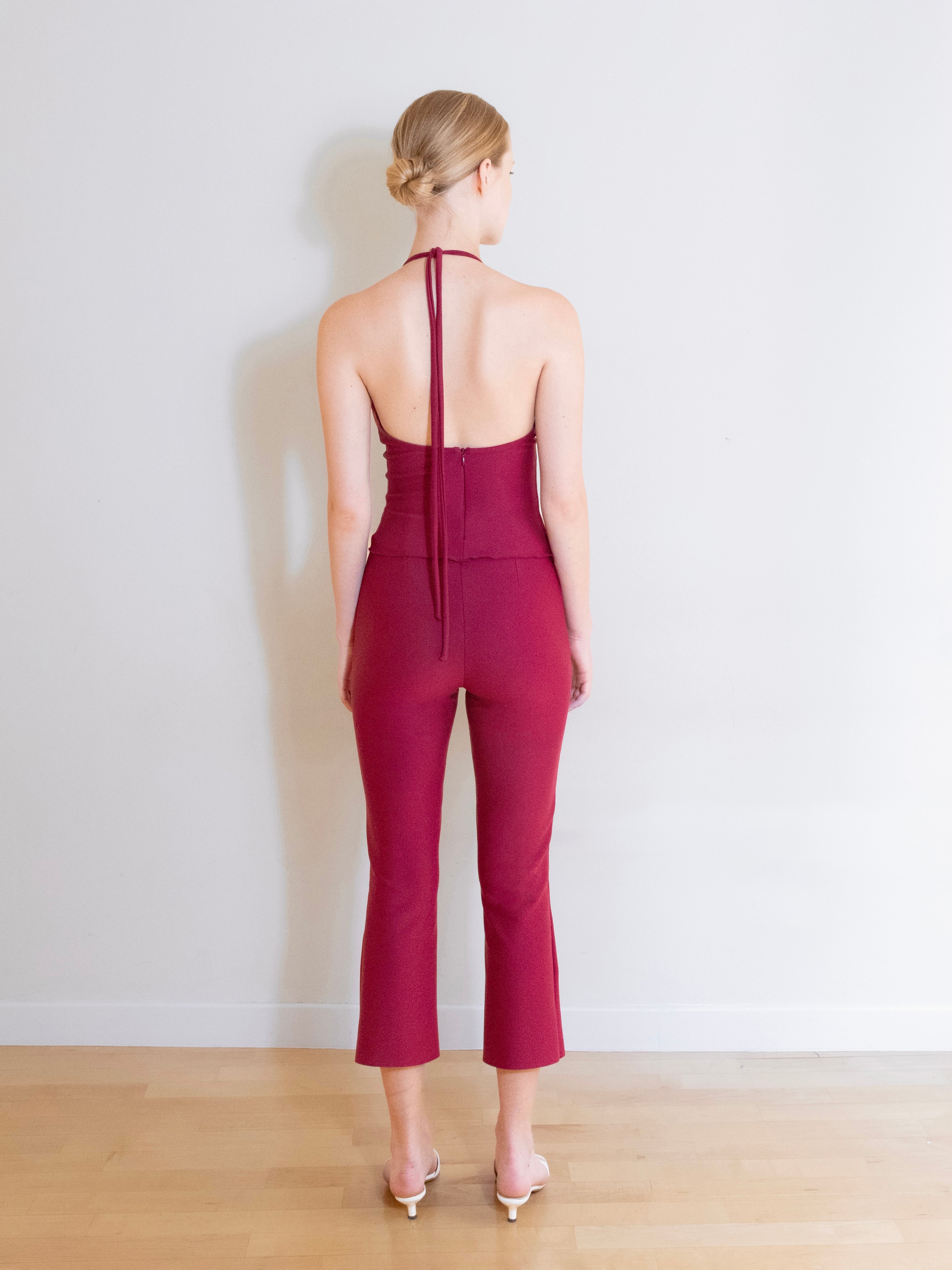 A model wearing the Luna knit capri pants in a white background. Made from soft, stretchy deadstock fabric