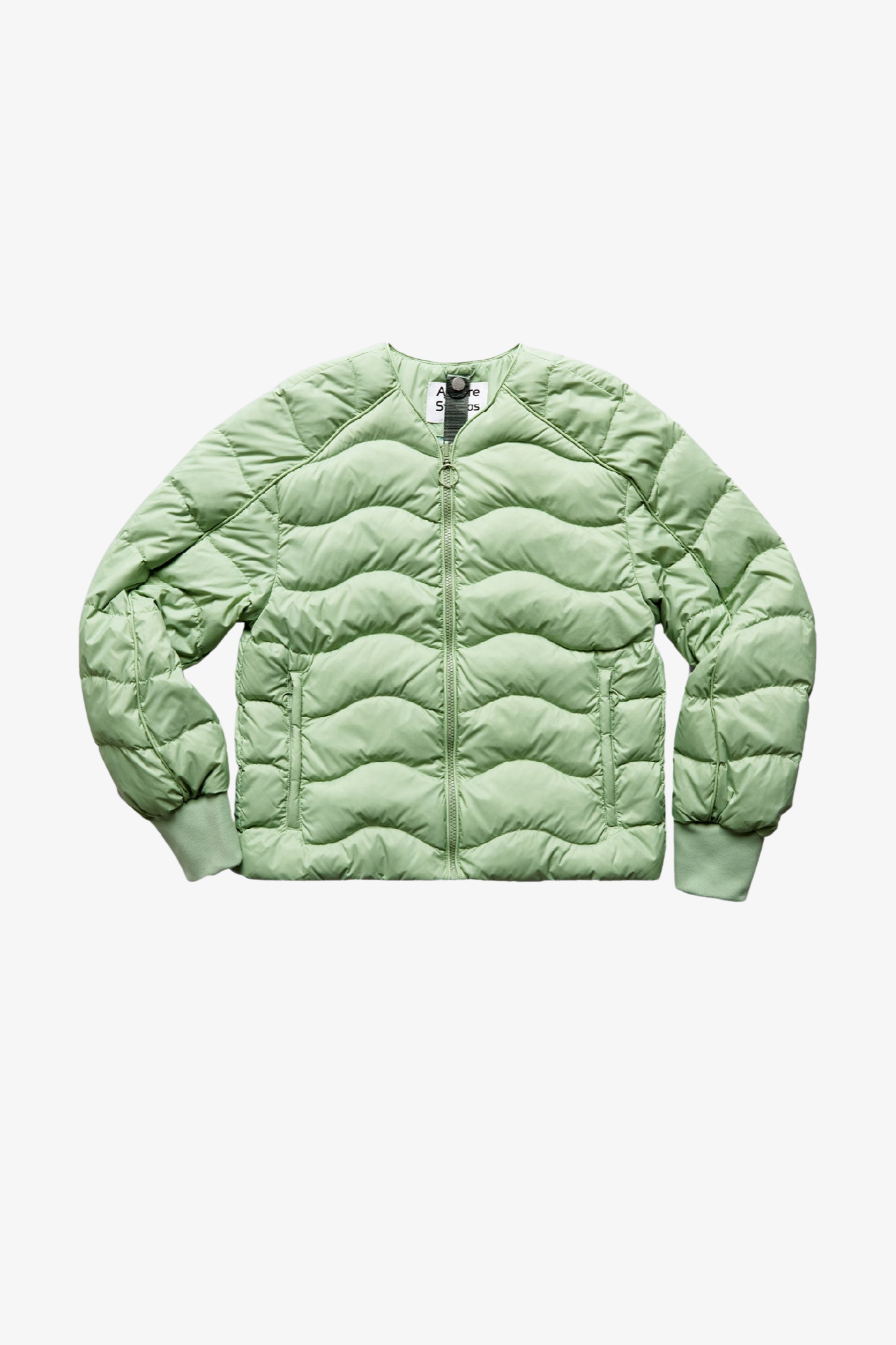 A light puffer jacket in a white background. 100% made from recycled fabric.
