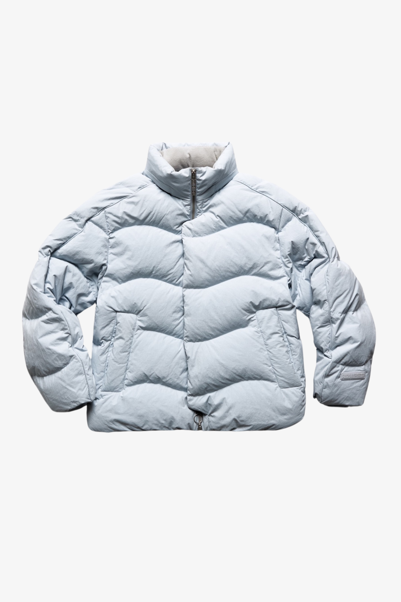 A puffer jacket in a white background. 100% made from recycled fabric.
