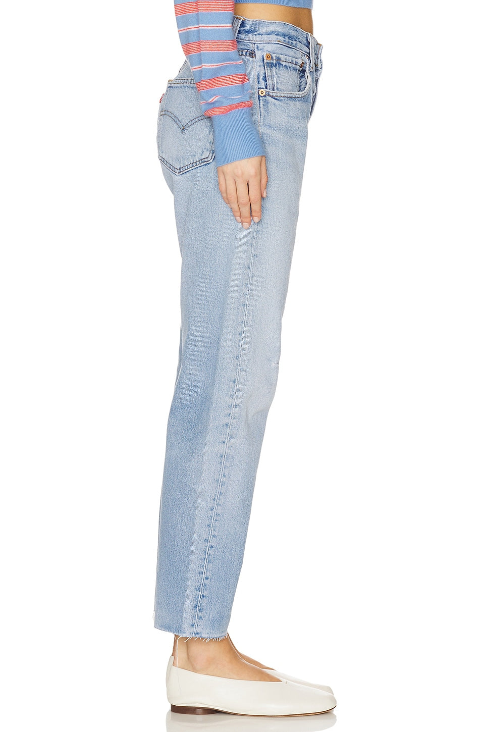 Model wearing the relax raw hem in a white background. 100% made from repurposed Levi’s.