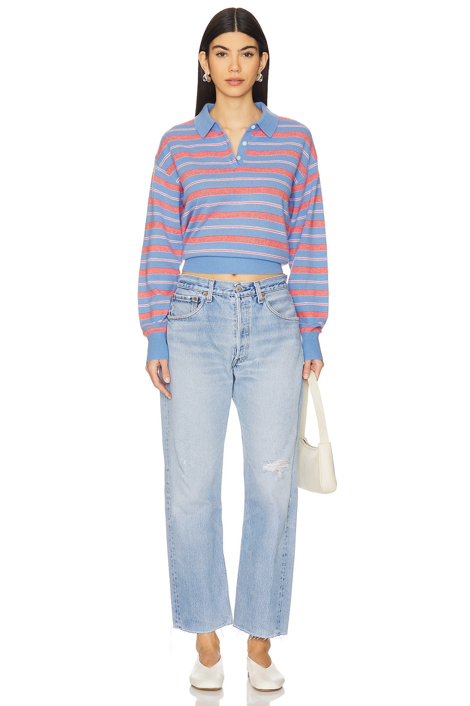 Model wearing the relax raw hem in a white background. 100% made from repurposed Levi’s.