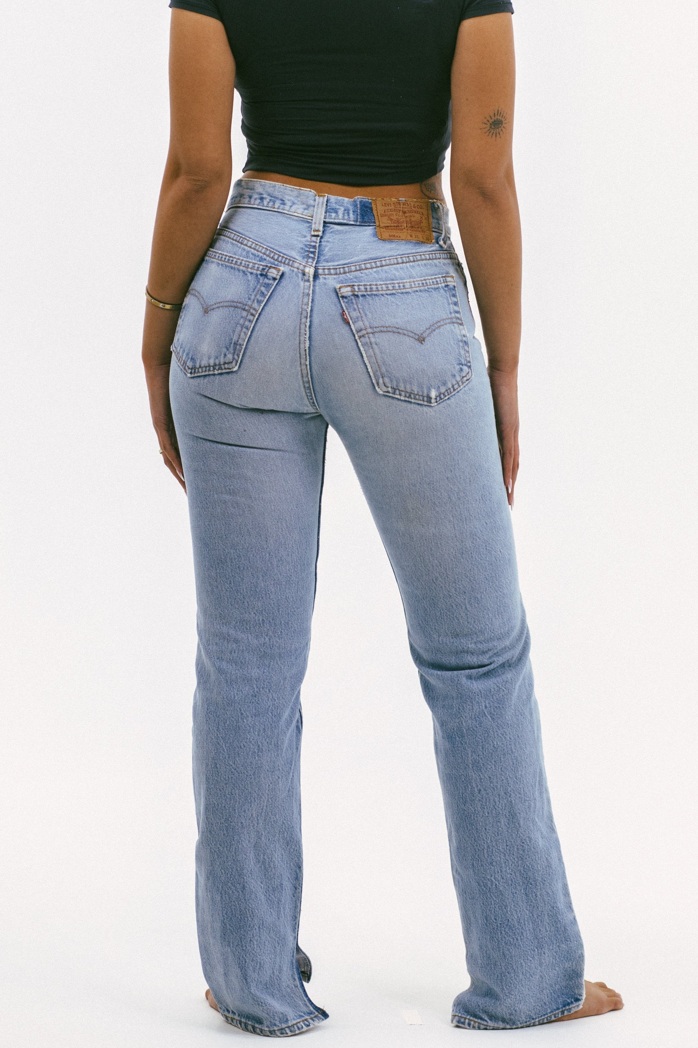 Model wearing the relaxed split in a white background. 100% made from repurposed Levi’s.
