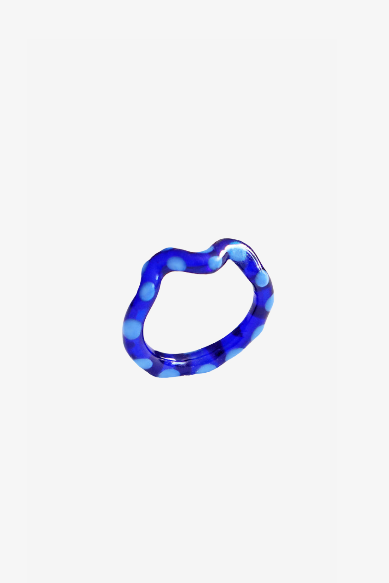 The single wave blueberry jelly ring in a white background. Ring are 3D printed and hand finished. Made in New York.
