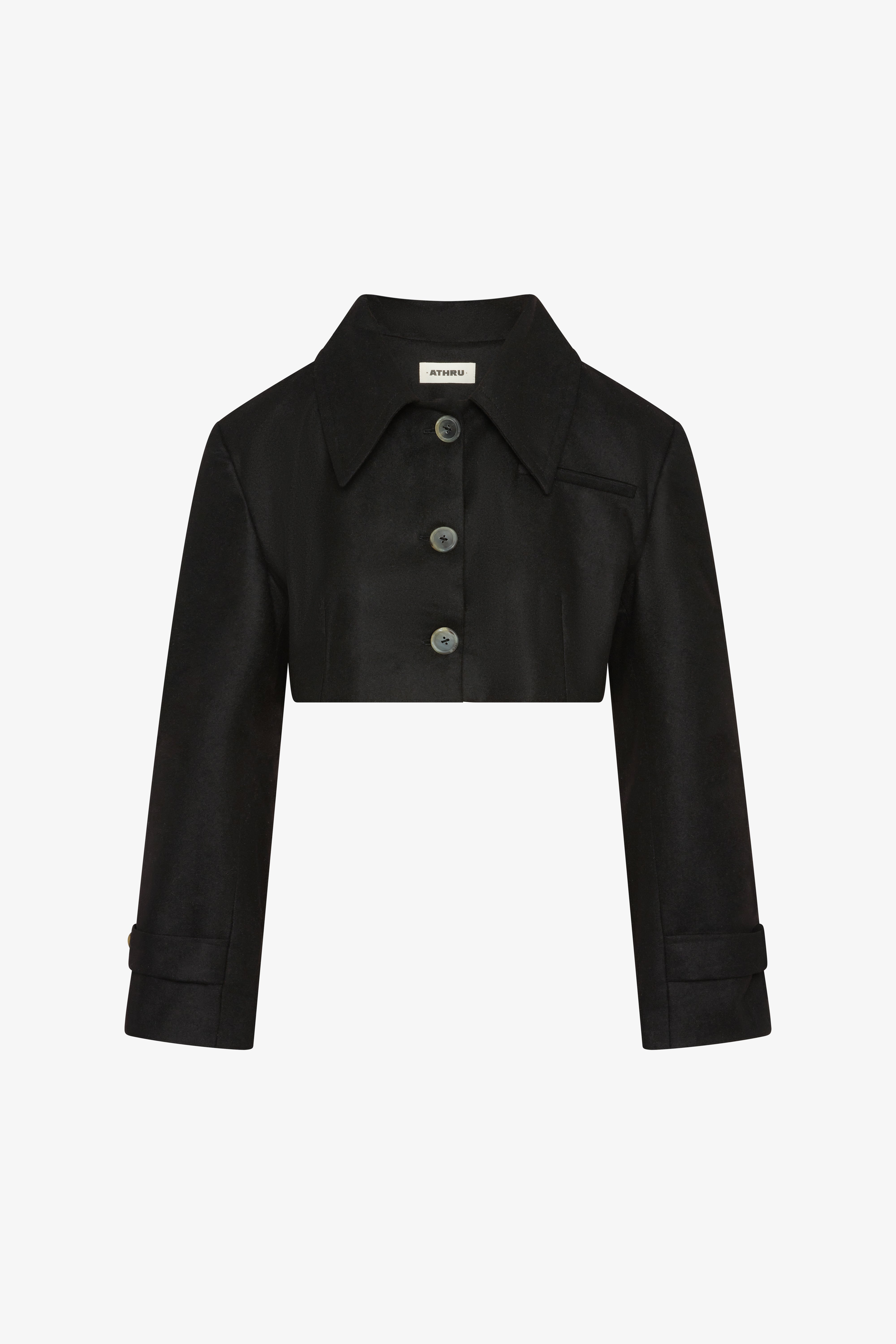 The triangle black jacket in a white background. 100% made from mulesing-free merino wool.