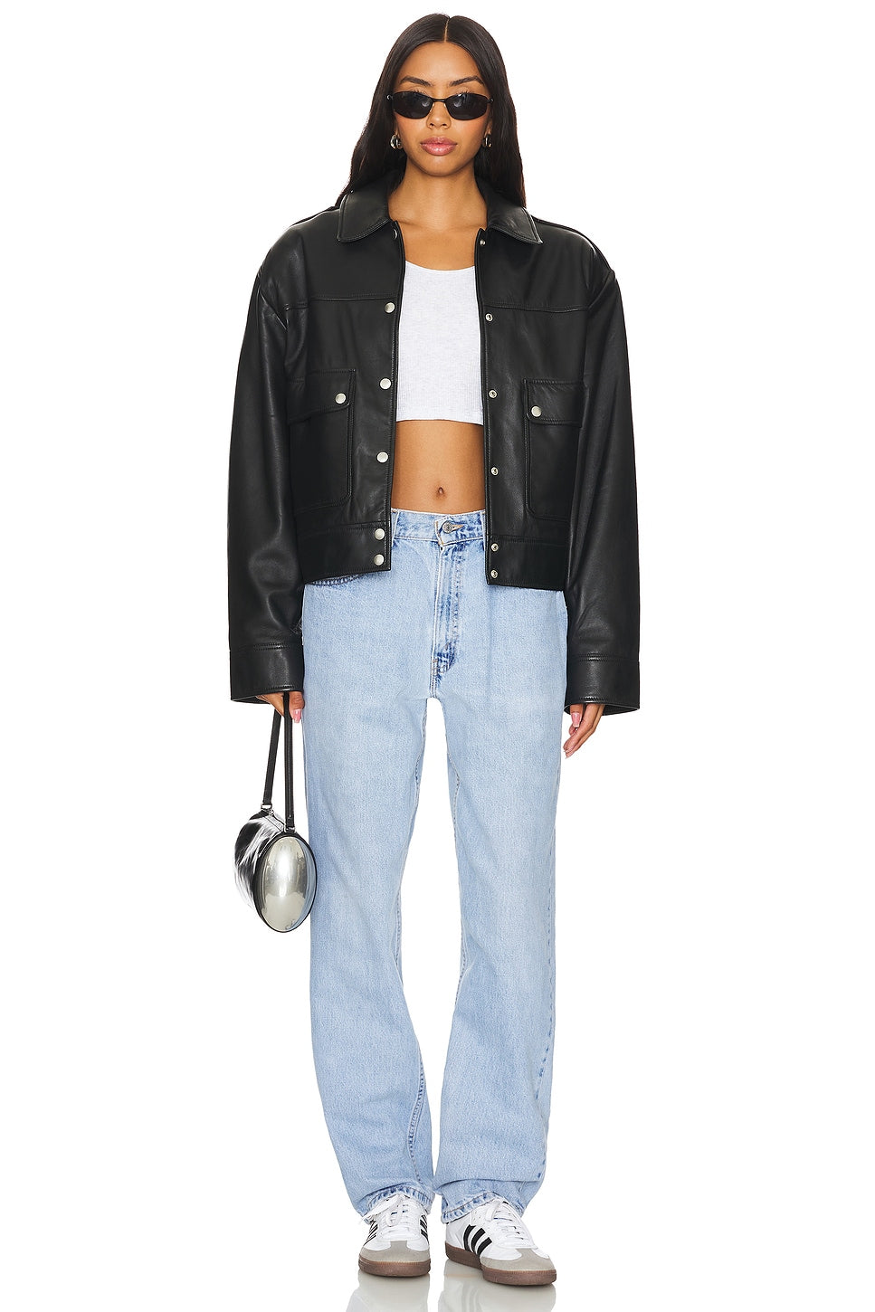 Model wearing an ultra baggy customs in a white background. 100% made from repurposed Levi’s.