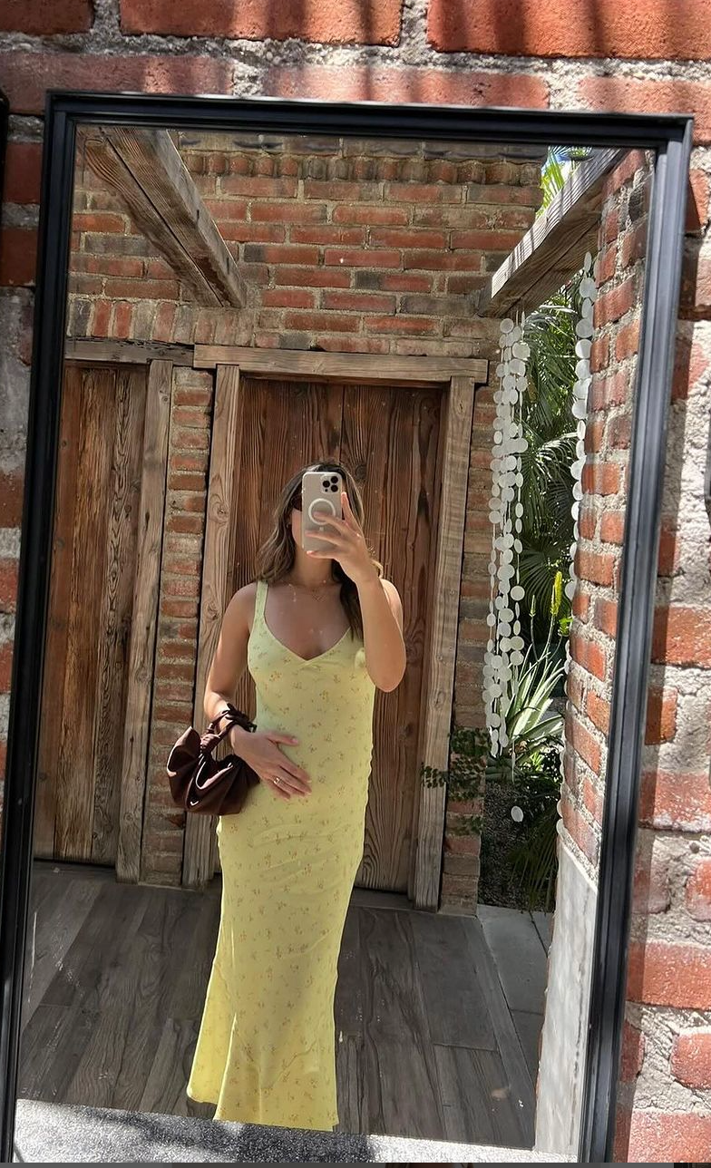 A model wearing the chocolate silk knot bag. Deadstock silky satin fabric sourced in Los Angeles.