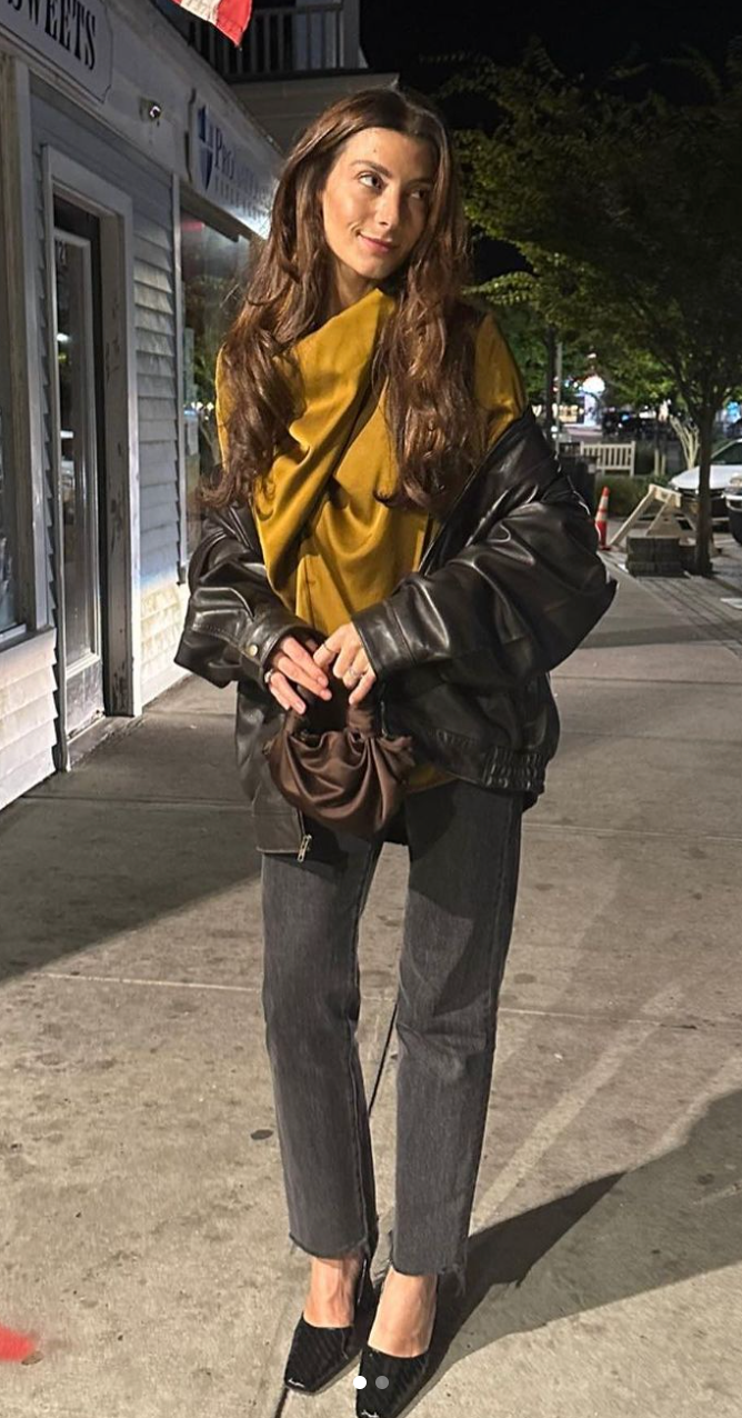 A model wearing the chocolate silk knot bag. Deadstock silky satin fabric sourced in Los Angeles.