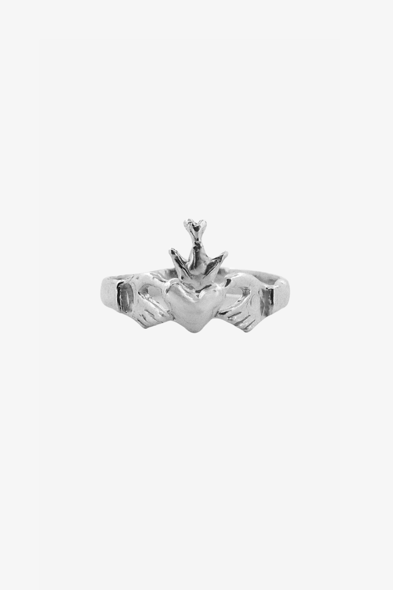 The claddagh ring in a white background. Made from 100% recycled metals and lab created gemstones.