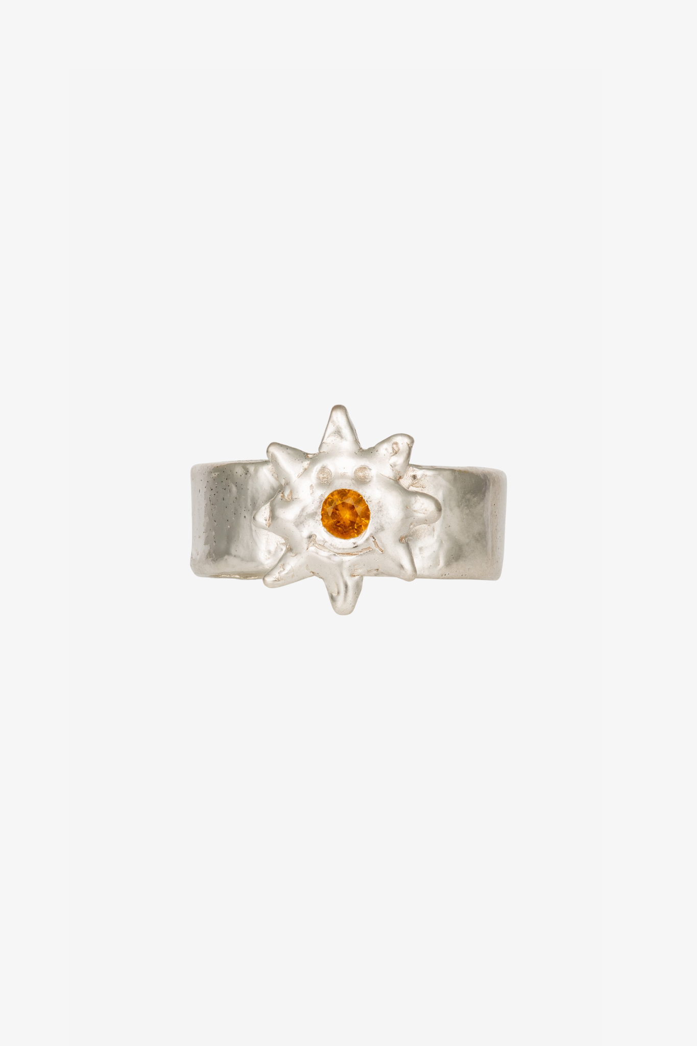 The custom sun clown ring in a white background. Made from 100% recycled metals and lab created gemstones.