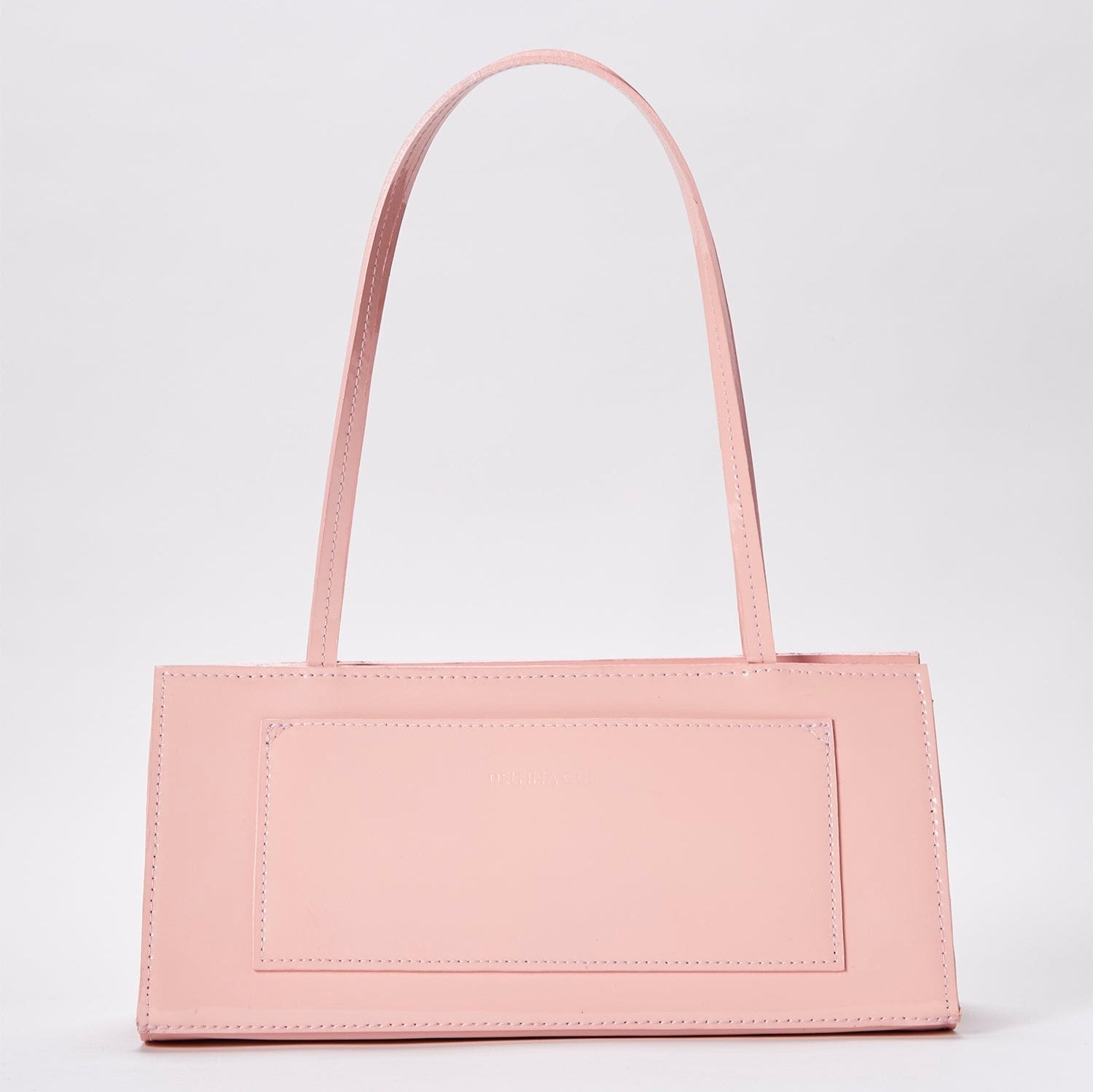 The hotdog powder pink bag in a white background. 100% made from deadstock leather.