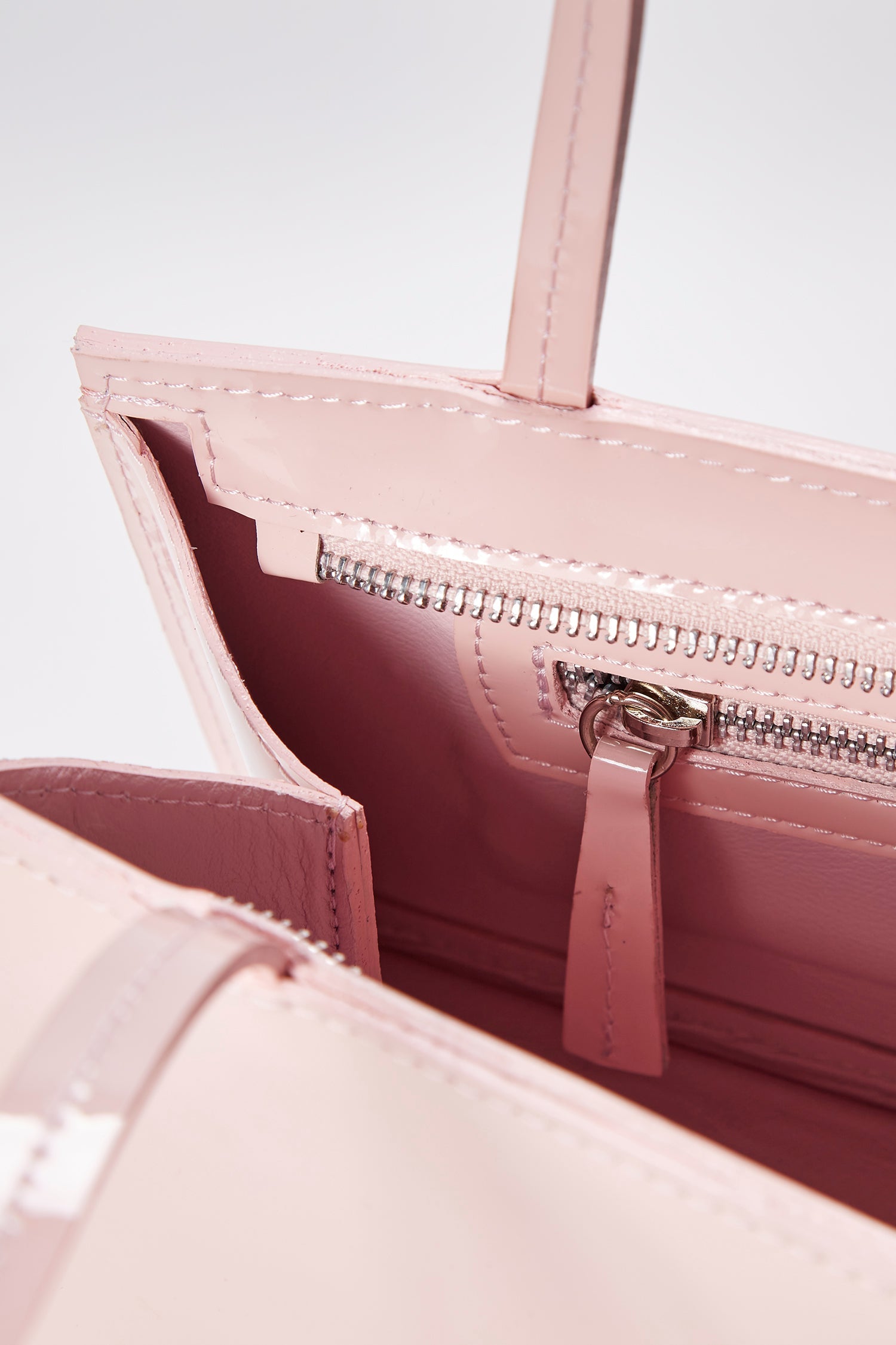 Close-up of the hotdog powder pink bag in a white background. 100% made from deadstock leather.