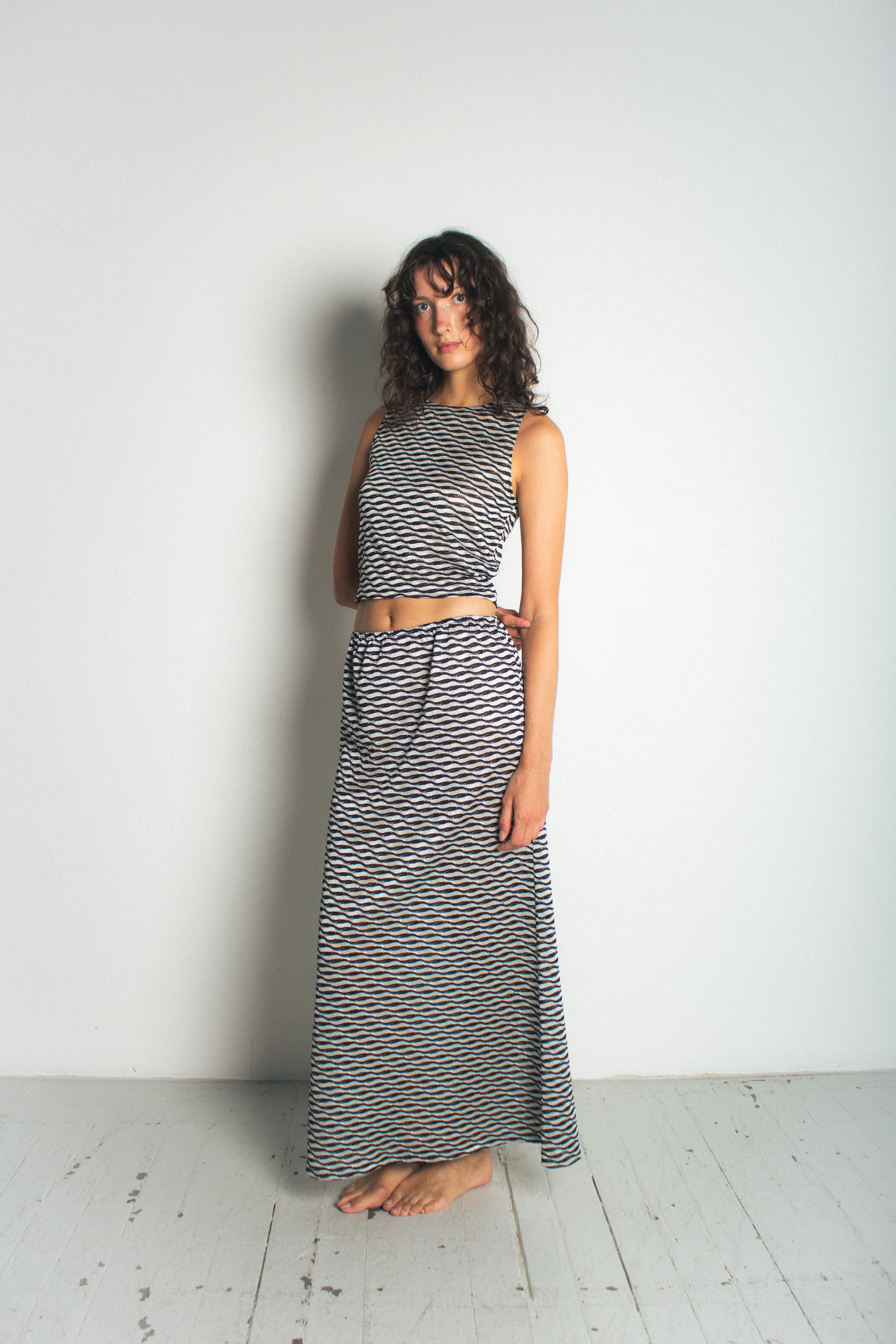 A model wearing t he ivy tank in a white background. 100% deadstock Missoni-like fabric.