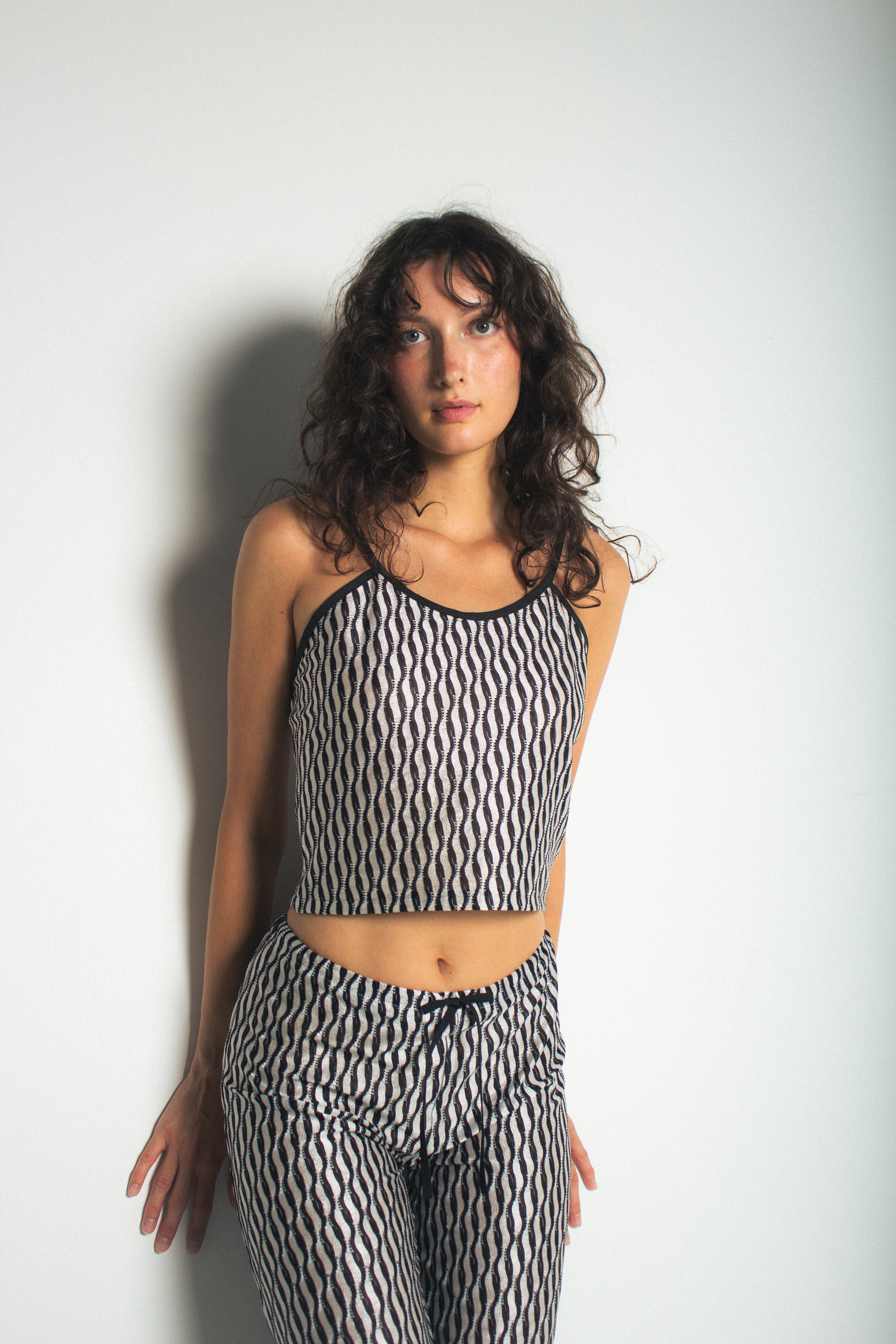 A model wearing the lola tank in a white background. 100% deadstock Missoni-like fabric