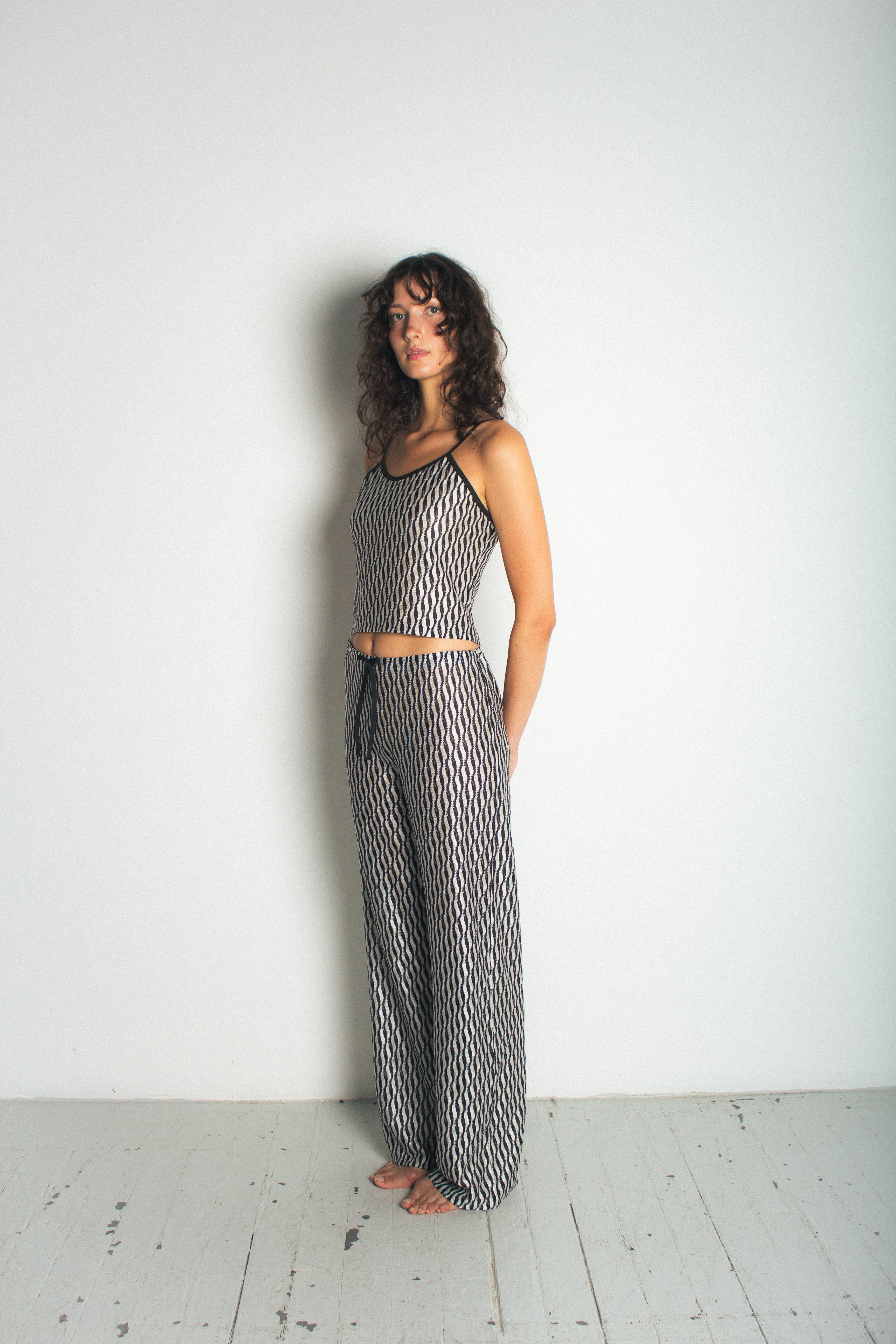 A model wearing the lola tank in a white background. 100% deadstock Missoni-like fabric