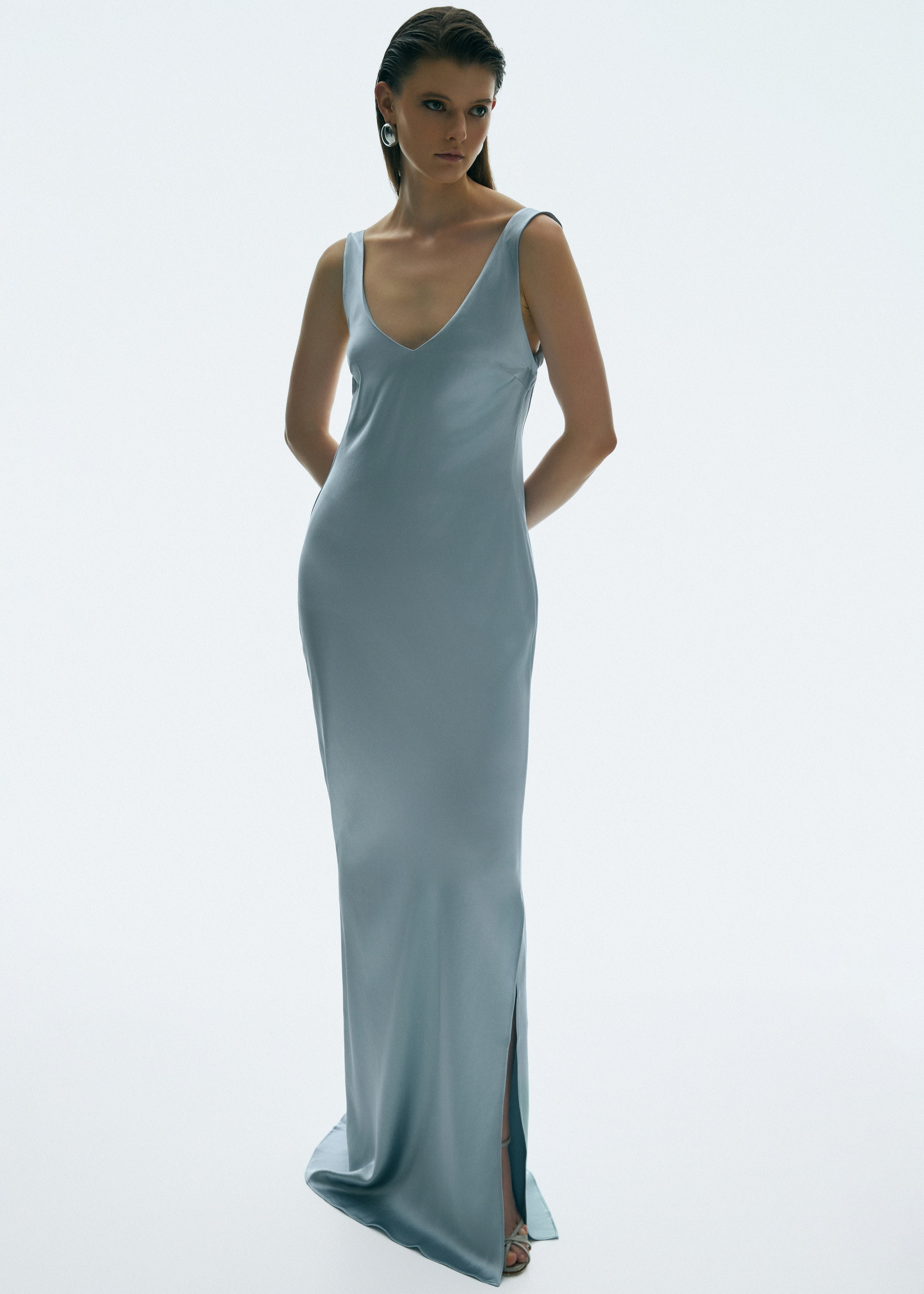 The blue ice gaia gown in a white background. Crafted from 100% silk satin.