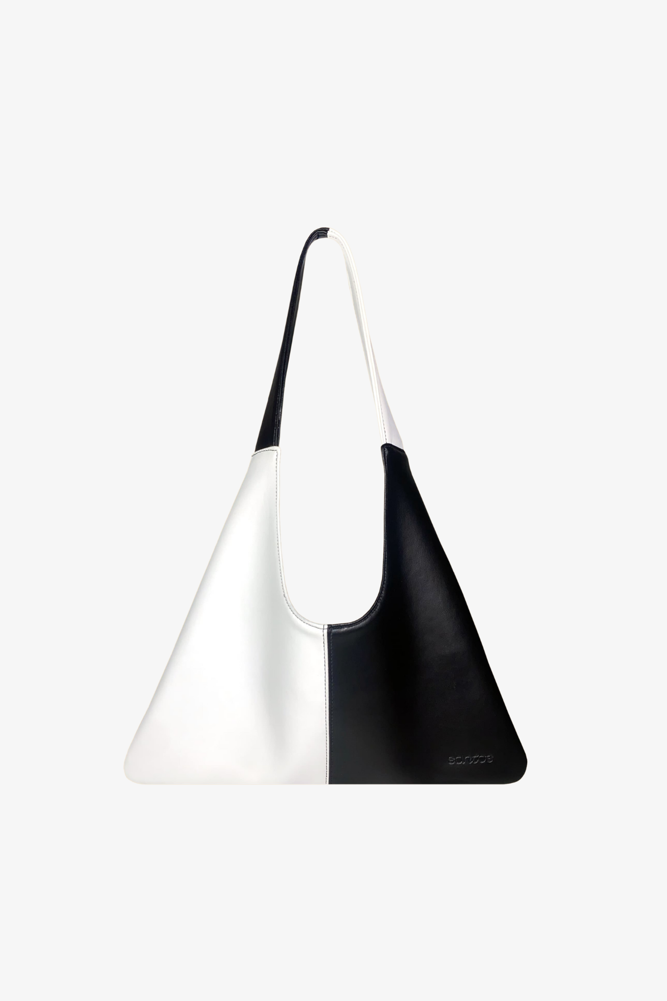 Black and white handbag made from cactus leather on a light gray background