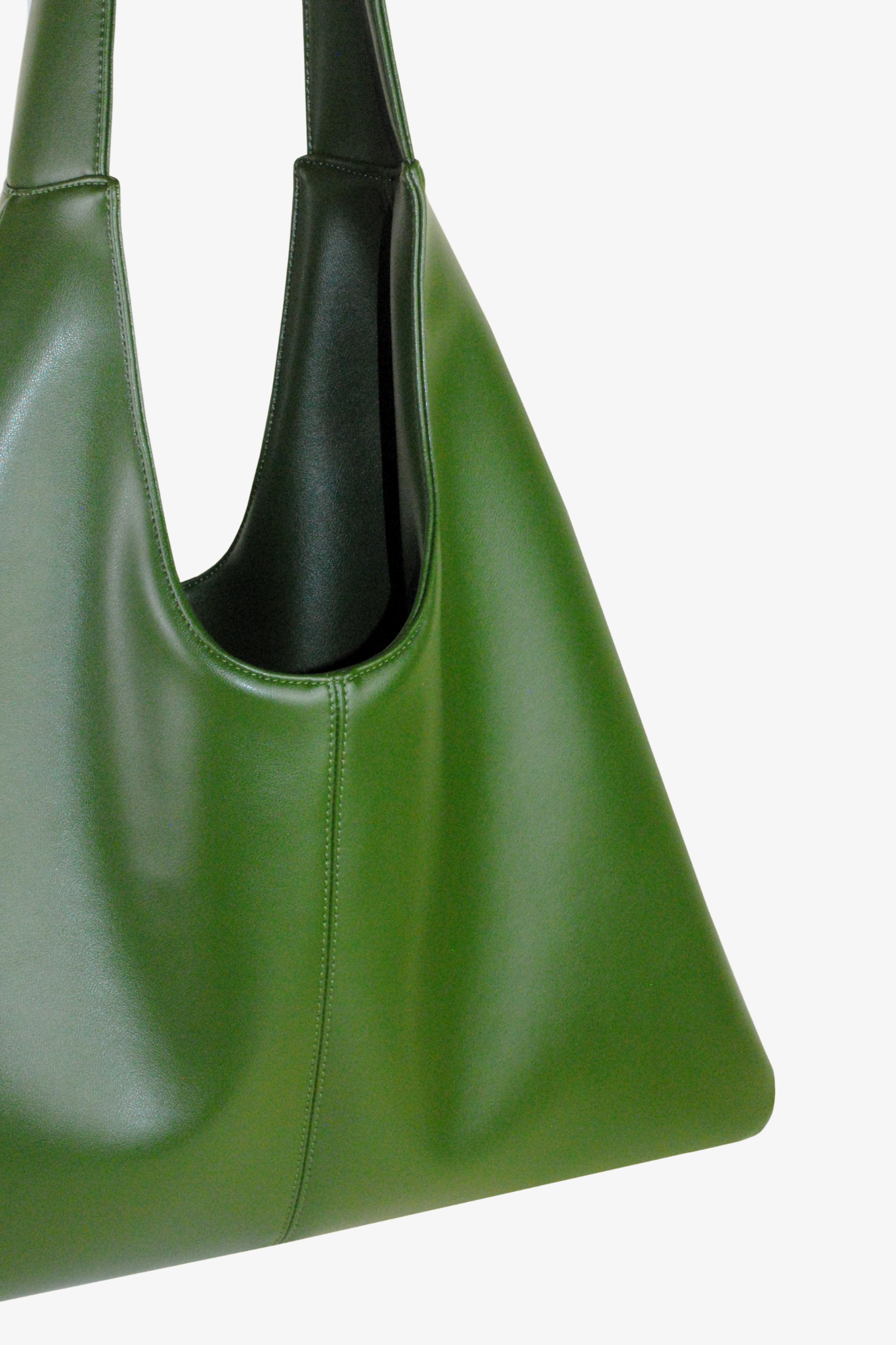Green cactus leather handbag on a white background