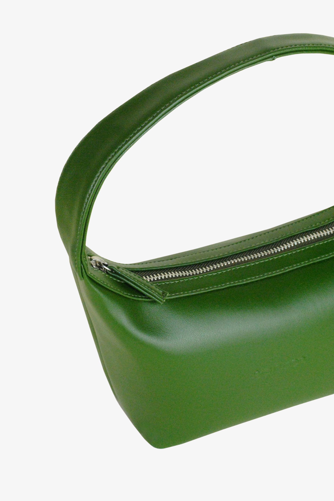 Green sustainable handbag with a zipper on a white background. Made from cactus leather. 